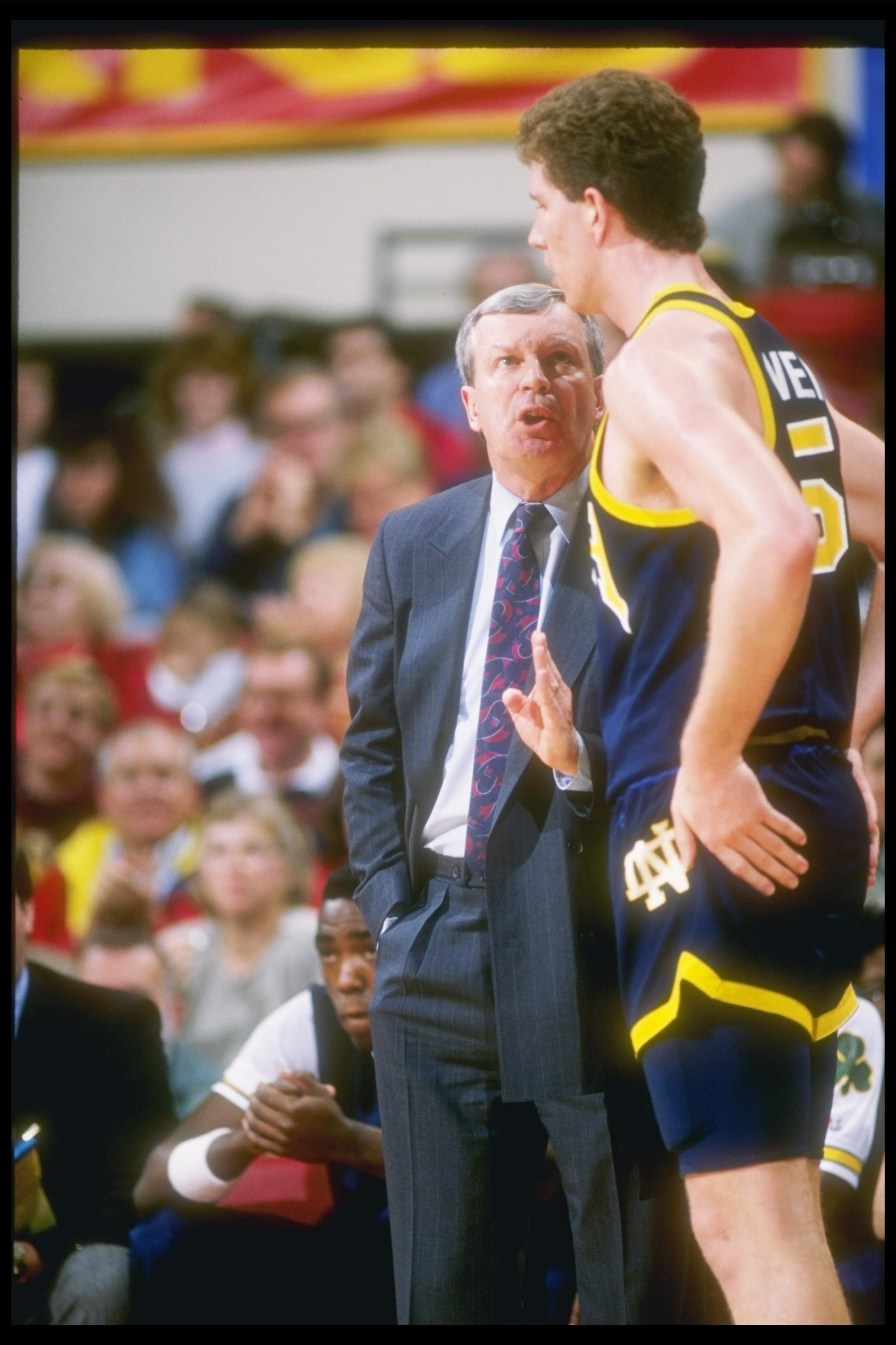 1989-1990:  Notre Dame Fighting Irish coach Digger Phelps confers with a player during a game. Mandatory Credit: Stephen Dunn  /Allsport