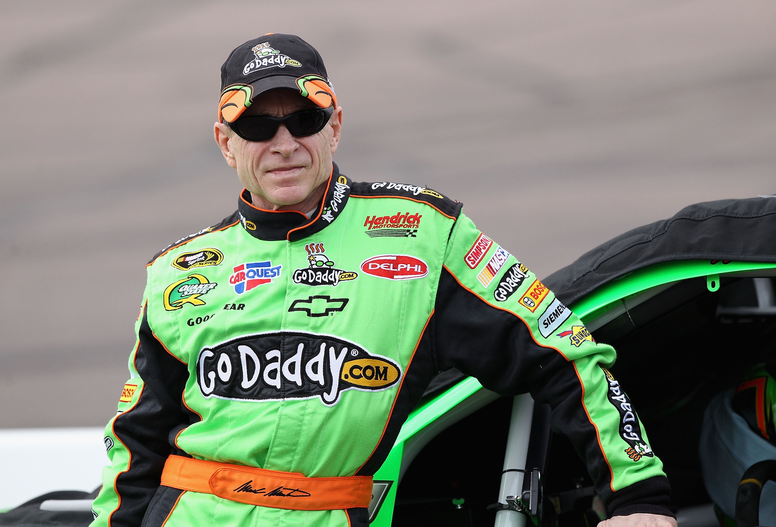 AVONDALE, AZ - FEBRUARY 26: Mark Martin, driver of the #5 GoDaddy.com Chevrolet, stands on pit road during qualifying for the NASCAR Sprint Cup Series Subway Fresh Fit 500 at Phoenix International Raceway on February 26, 2011 in Avondale, Arizona. (Phot AVONDALE, AZ - FEBRUARY 26: Mark Martin, driver of the #5 GoDaddy.com Chevrolet, stands on pit road during qualifying for the NASCAR Sprint Cup Series Subway Fresh Fit 500 at Phoenix International Raceway on February 26, 2011 in Avondale, Arizona. (Phot