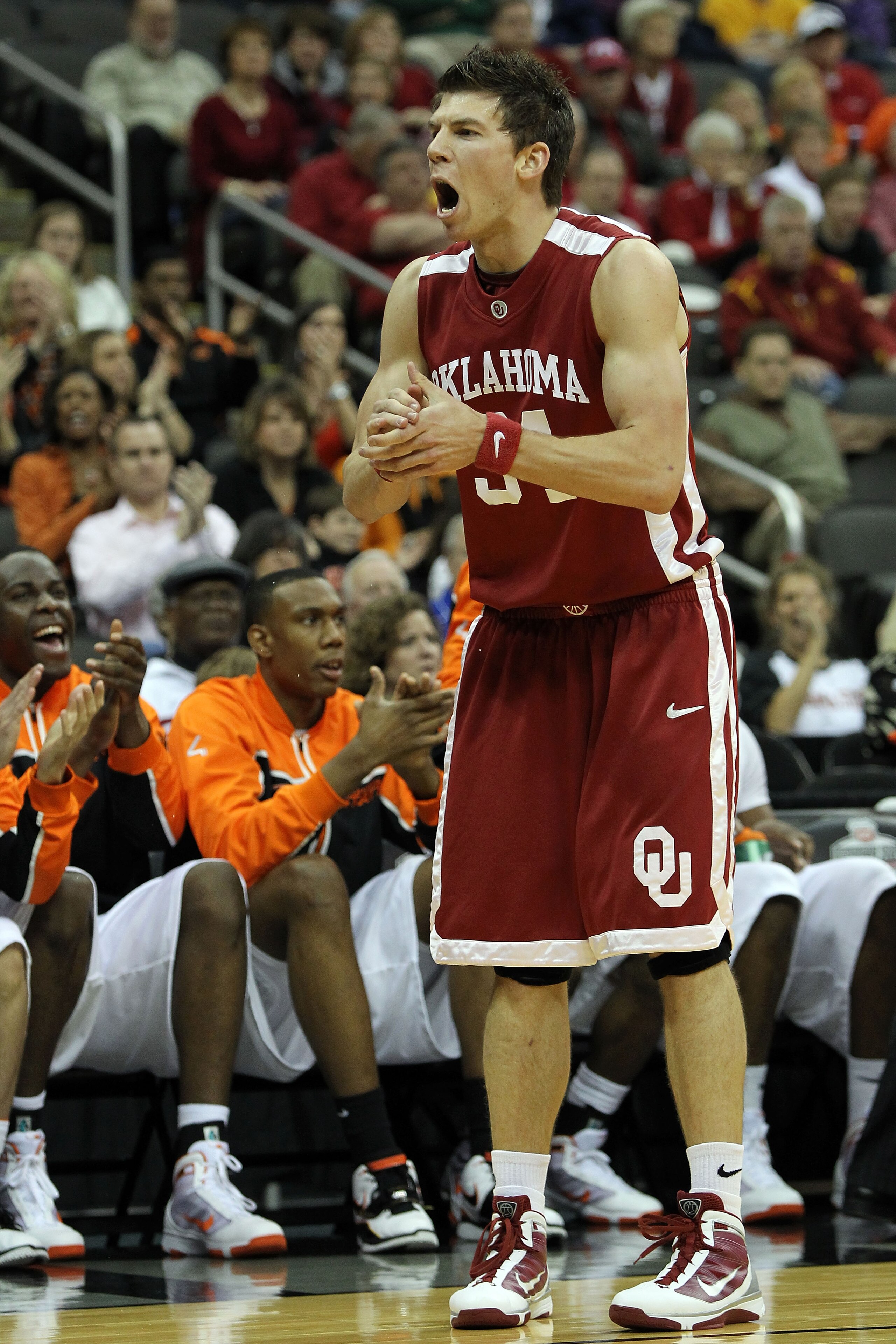 KANSAS CITY, MO - MARCH 10:  Cade Davis #34 of the Oklahoma Sooners reacts in the first half against the Oklahoma State Cowboys during the first round game of the 2010 Phillips 66 Big 12 Men's Basketball Tournament at the Sprint Center on March 10, 2010 i