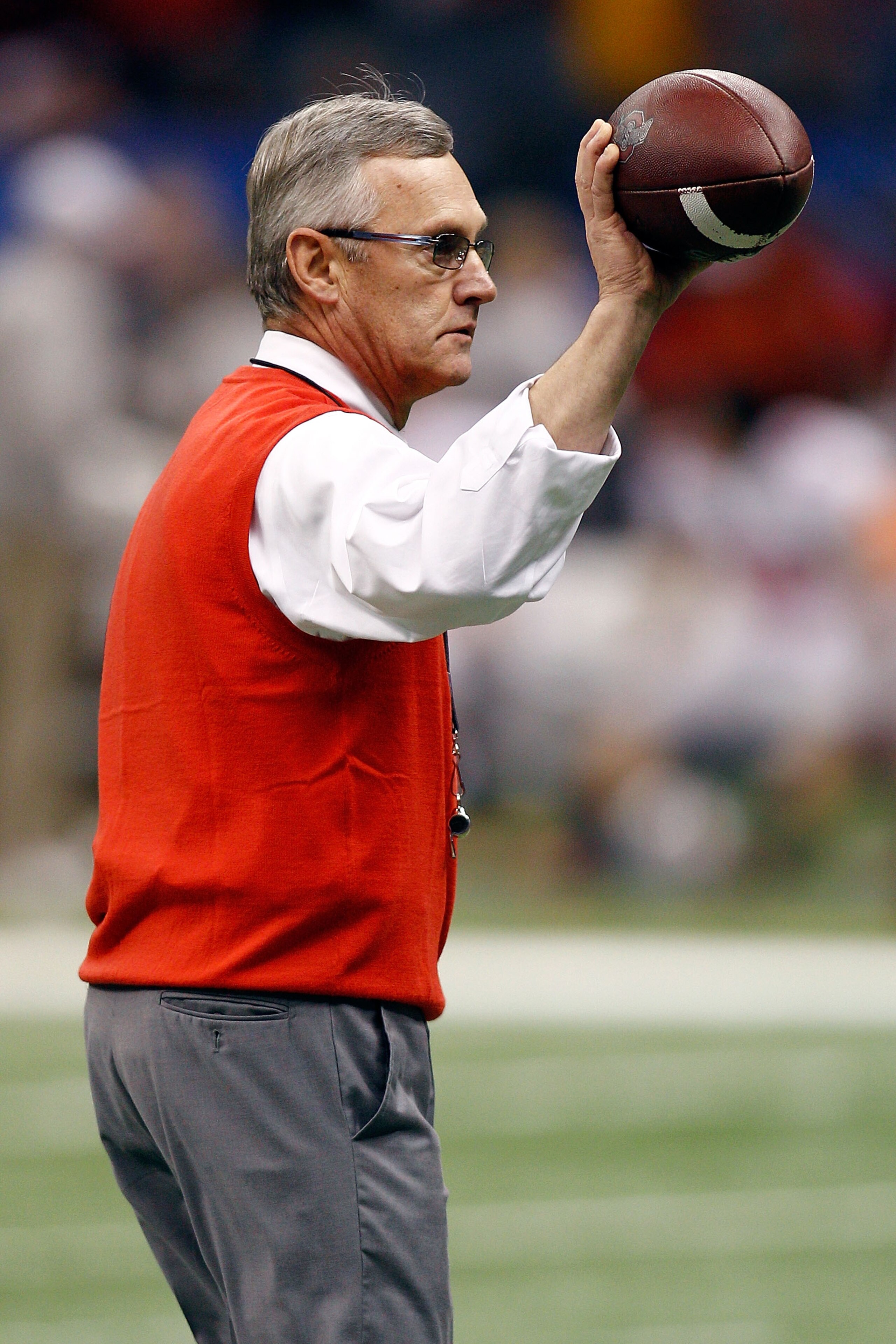 NEW ORLEANS, LA - JANUARY 04:  Head coach Jim Tressel of the Ohio State Buckeyes holds the football before the Allstate Sugar Bowl against the Arkansas Razorbacks at the Louisiana Superdome on January 4, 2011 in New Orleans, Louisiana.  (Photo by Chris Gr