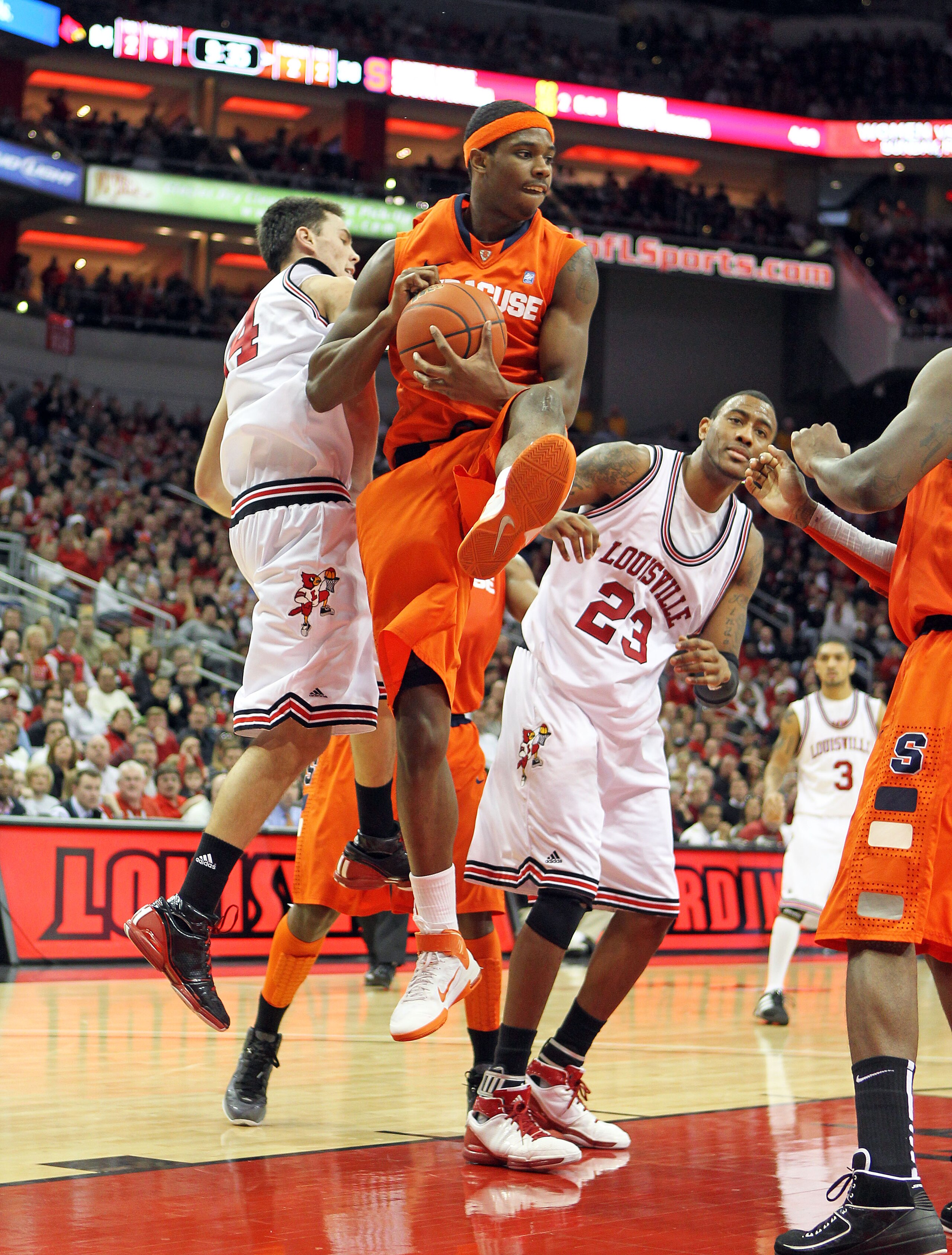 LOUISVILLE, KY - FEBRUARY 12:  C.J. Fair #5 of the Syracuse Orange reaches for a rebound during the Big East Conference game against the Louisville Cardinals at the KFC Yum! Center on February 12, 2011 in Louisville, Kentucky.  Louisville won 73-69.  (Pho
