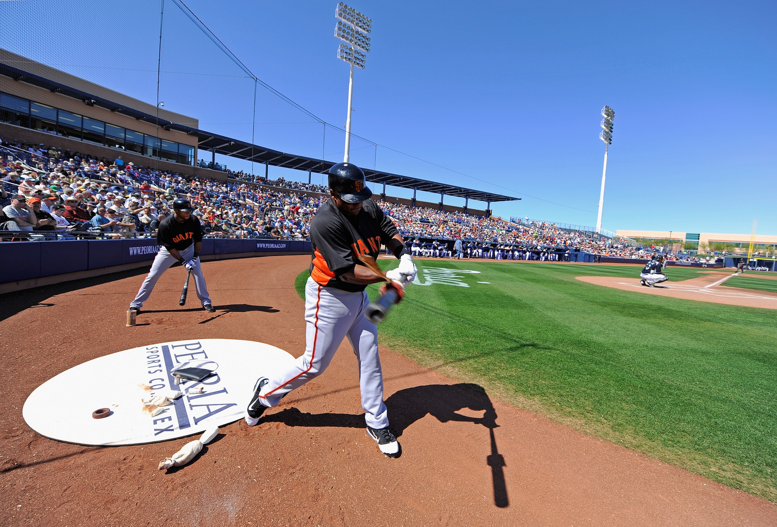 PEORIA, AZ - MARCH 08:  Miguel Tejada #10 of the San Francisco Giants swings the bat on the on-deck circle during the spring training baseball game against Seattle Mariners at Peoria Stadium on March 8, 2011 in Peoria, Arizona.  (Photo by Kevork Djansezia