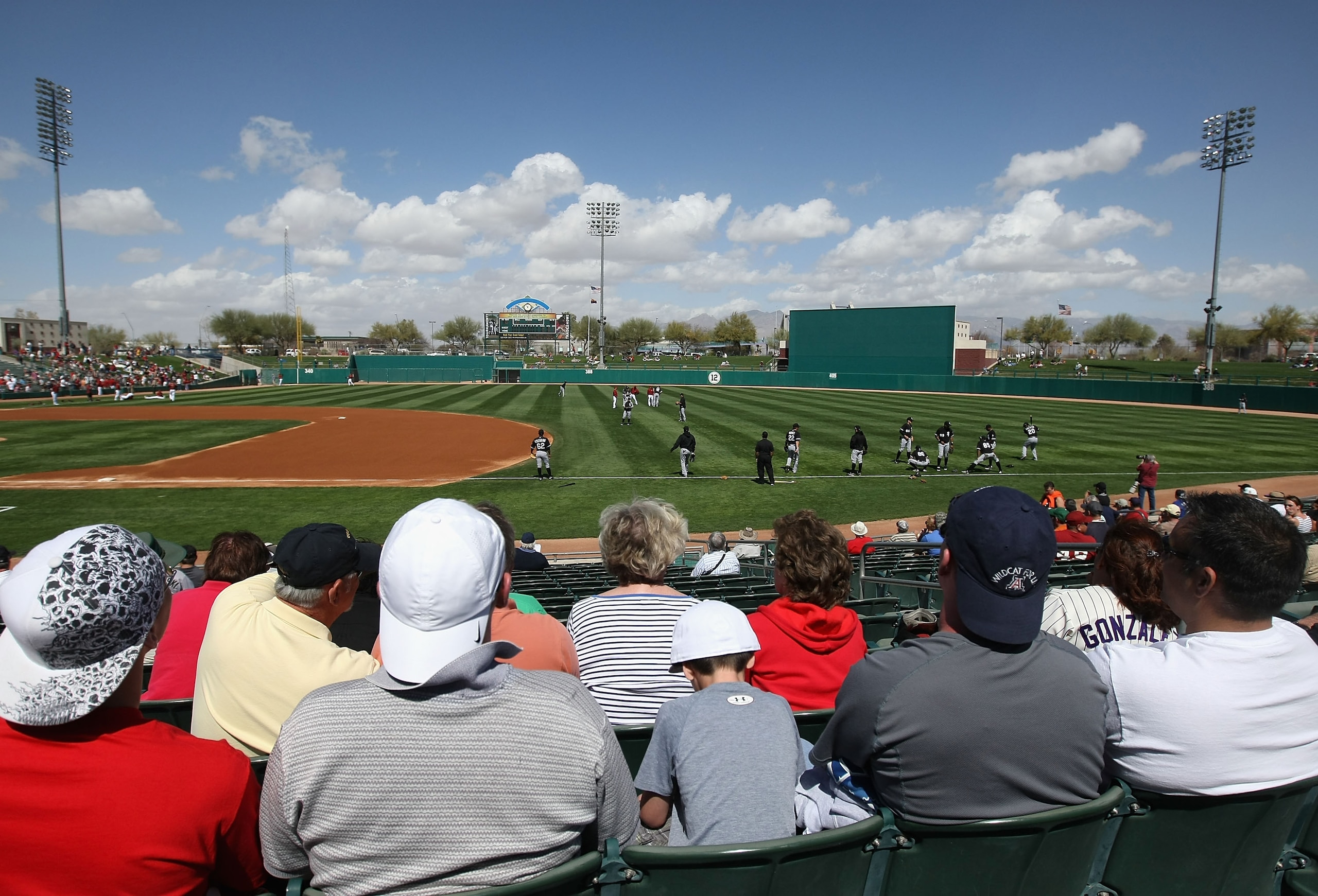 TUCSON, AZ - MARCH 07:  Fans watch the Chicago White Sox warm up before the spring training game against the Arizona Diamondbacks at Kino Veterans Memorial Stadium on March 7, 2011 in Tucson, Arizona. The charity game is to benefit the 9-year-old Christin