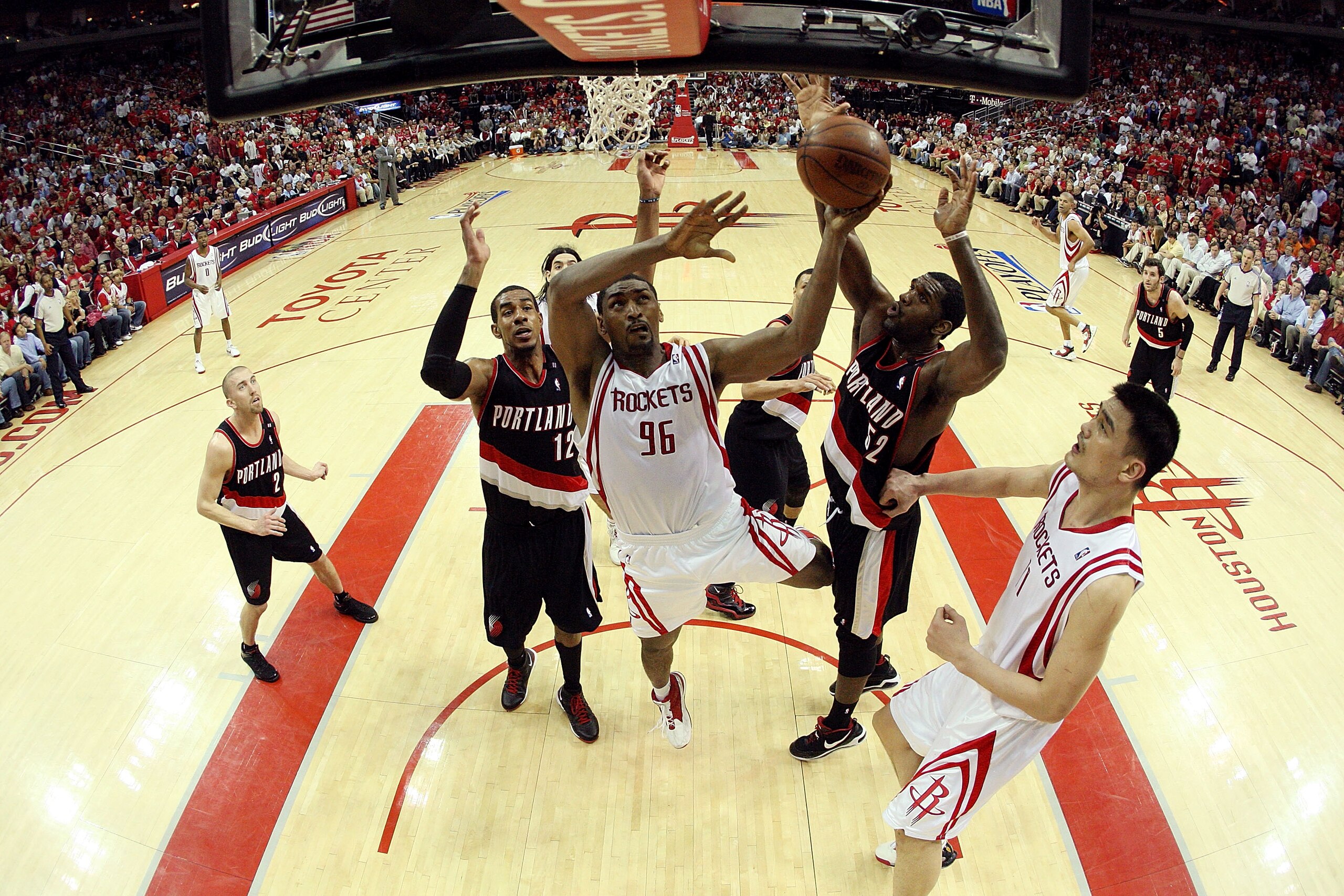 HOUSTON - APRIL 30:  Forward Ron Artest #96 of the Houston Rockets takes a shot against Greg Oden #52 and LaMarcus Aldridge #12 of the Portland Trail Blazers in Game Six of the Western Conference Quarterfinals during the 2009 NBA Playoffs at Toyota Center