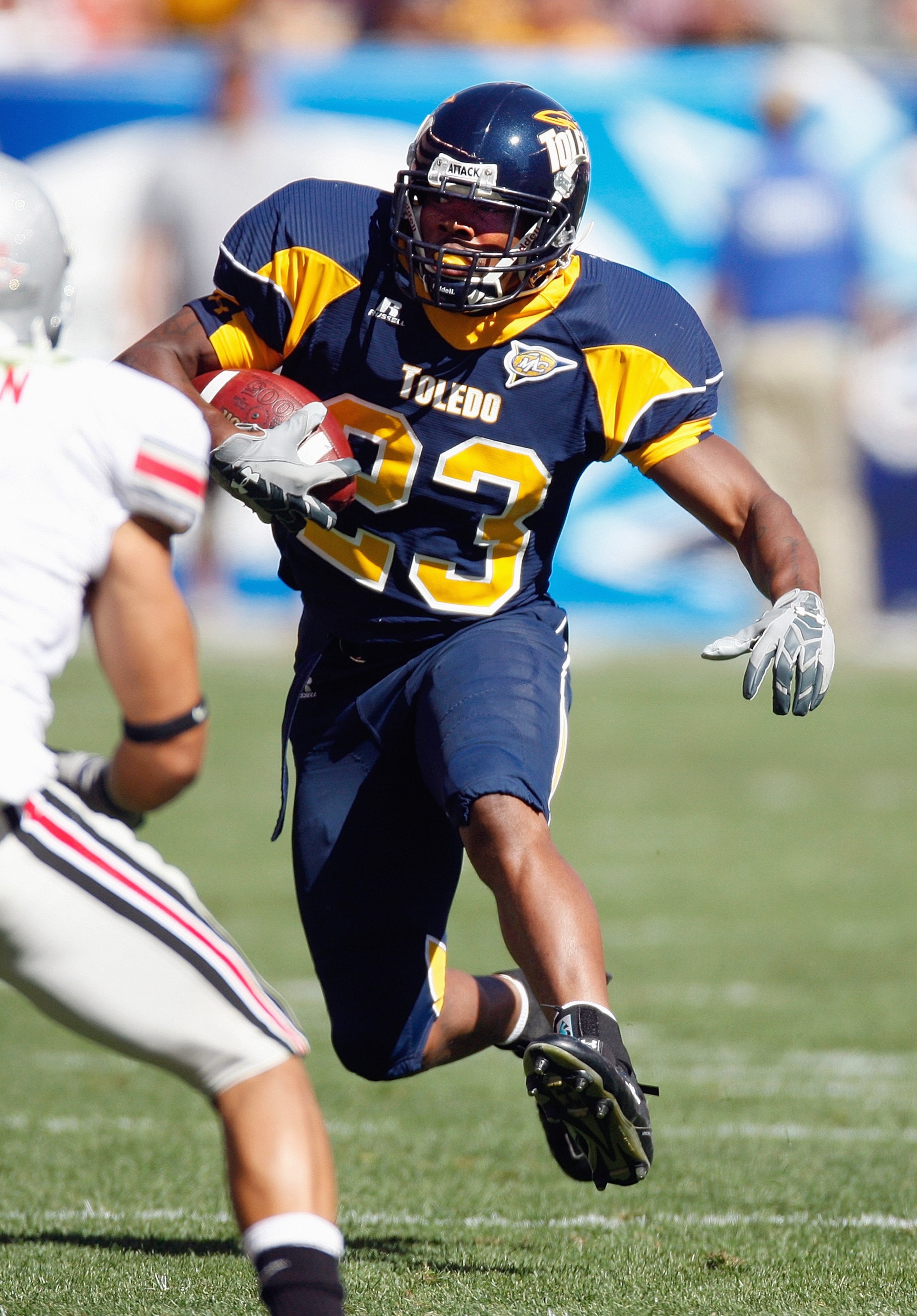 CLEVELAND - SEPTEMBER 19: Morgan Williams #23 of the Toledo Rockets carries the ball during the game against the Ohio State Buckeyes  at Cleveland Browns Stadium on September 19, 2009 in Cleveland, Ohio. The Ohio State Buckeyes shutout the Toledo Rockets 