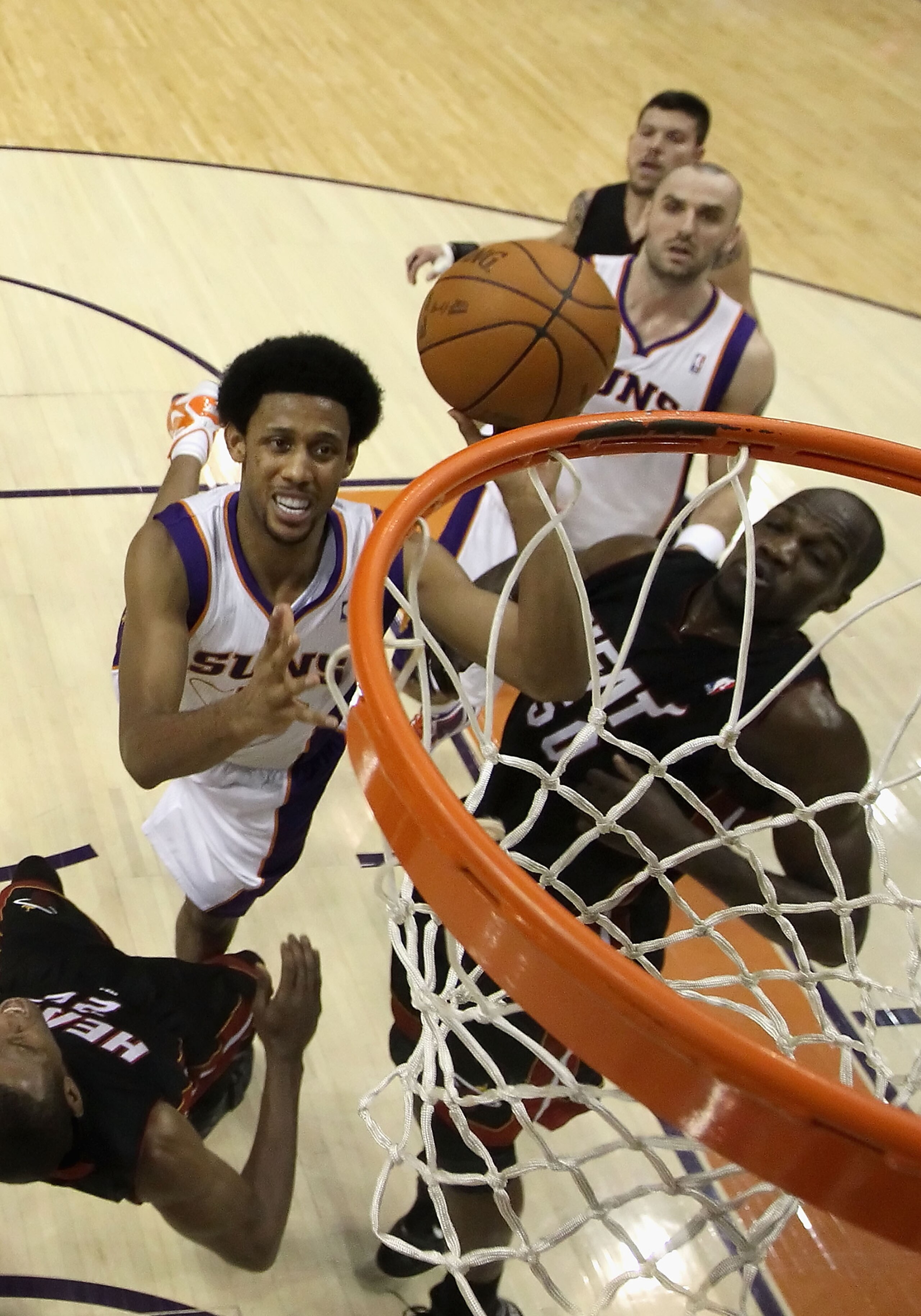 PHOENIX - DECEMBER 23:  Josh Childress #1 of the Phoenix Suns puts up a shot against the Miami Heat during the NBA game at US Airways Center on December 23, 2010 in Phoenix, Arizona.  The Heat defeated the Suns 95-83.  NOTE TO USER: User expressly acknowl