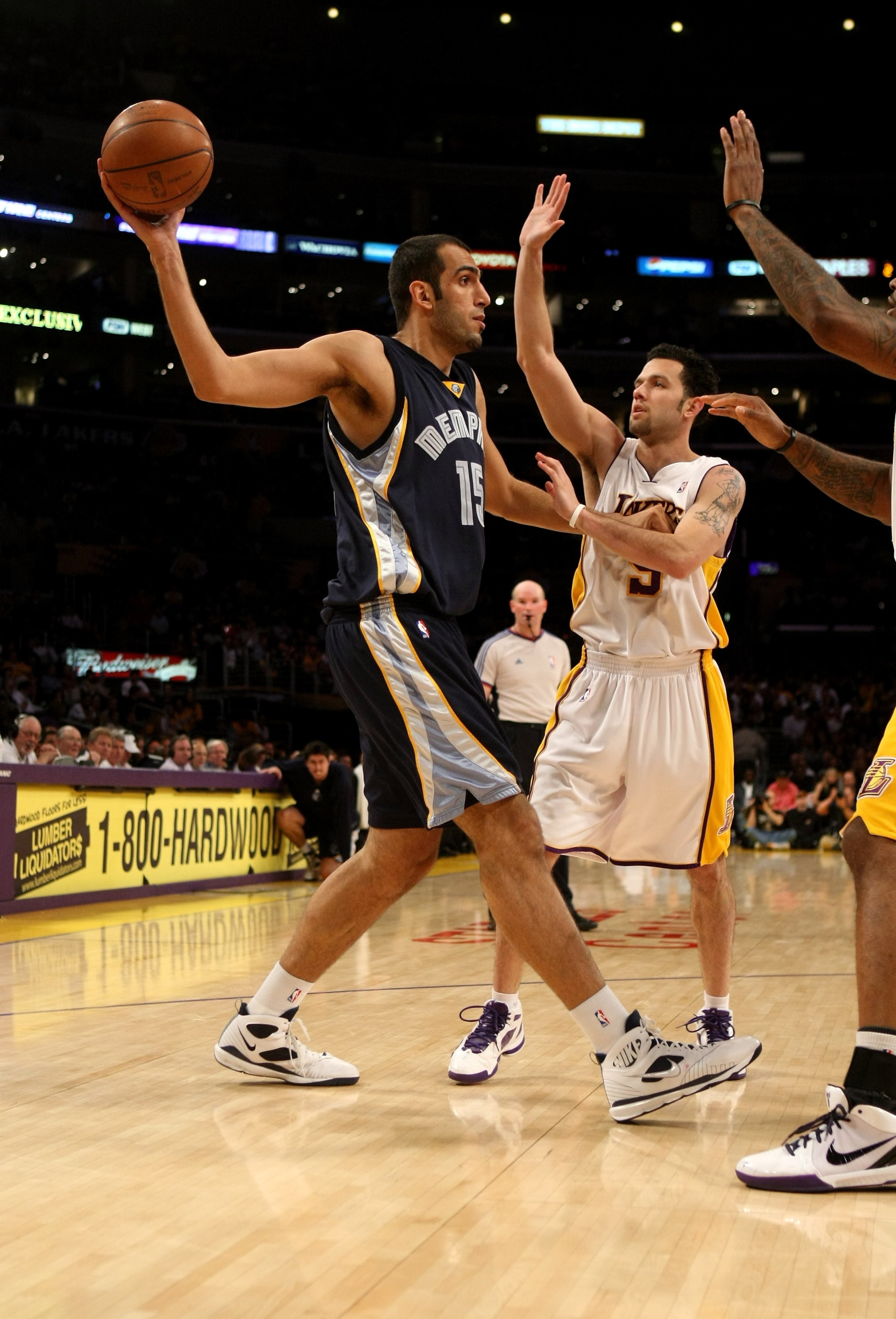 LOS ANGELES - APRIL 12:  Hamed Haddadi #15 of the Memphis Grizzlies controls the ball against Jordan Farmar #5 of the Los Angeles Lakers on April 12, 2009 at Staples Center in Los Angeles, California.  The Lakers won 92-75.  NOTE TO USER: User expressly a