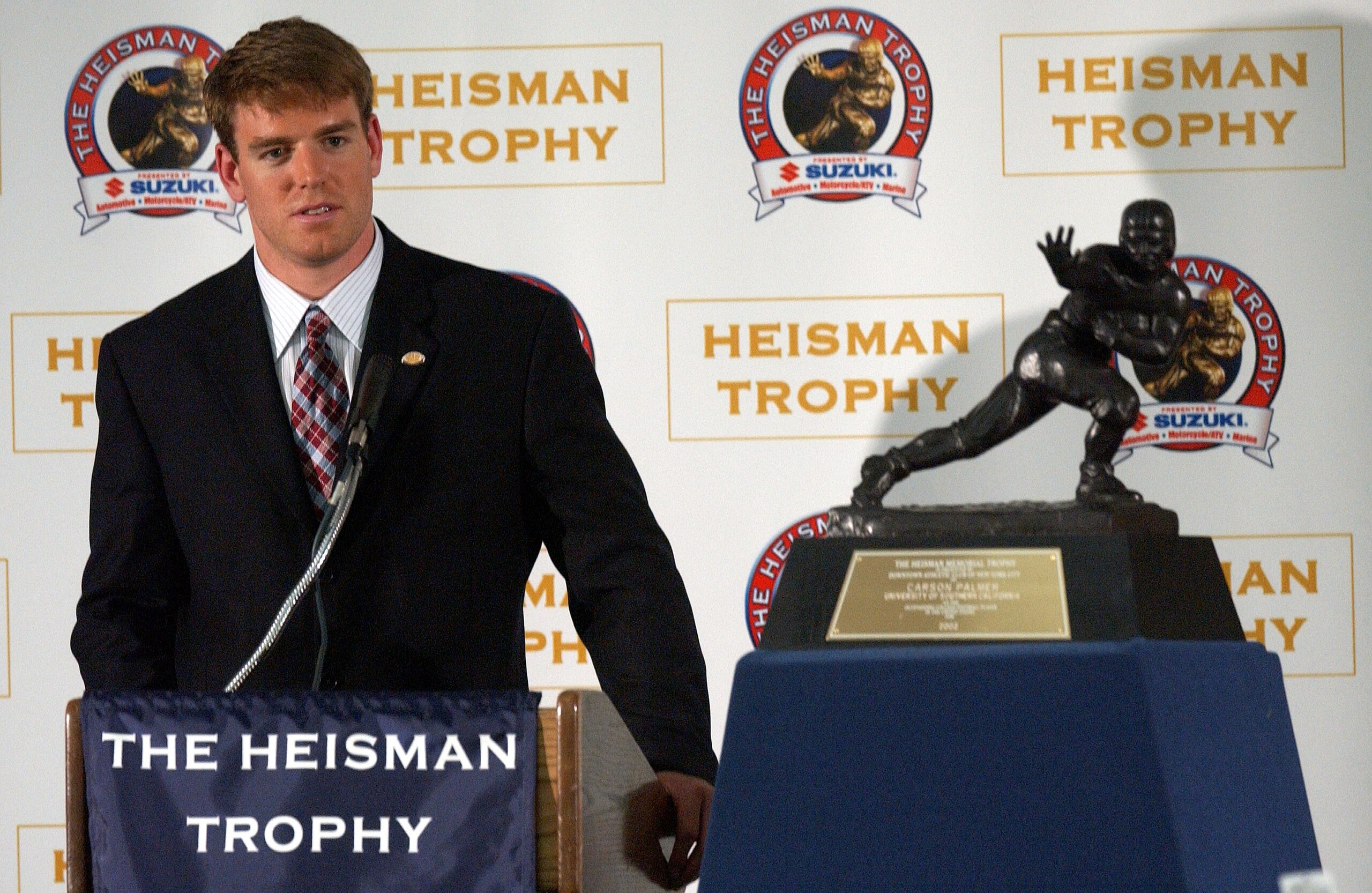 NEW YORK - DECEMBER 14:  Carson Palmer of the University of Southern California speaks with the press after winning the 68th annual Heisman Trophy Award at The Yale Club December 14, 2002 in New York City. The USC quarterback became the first west coast p