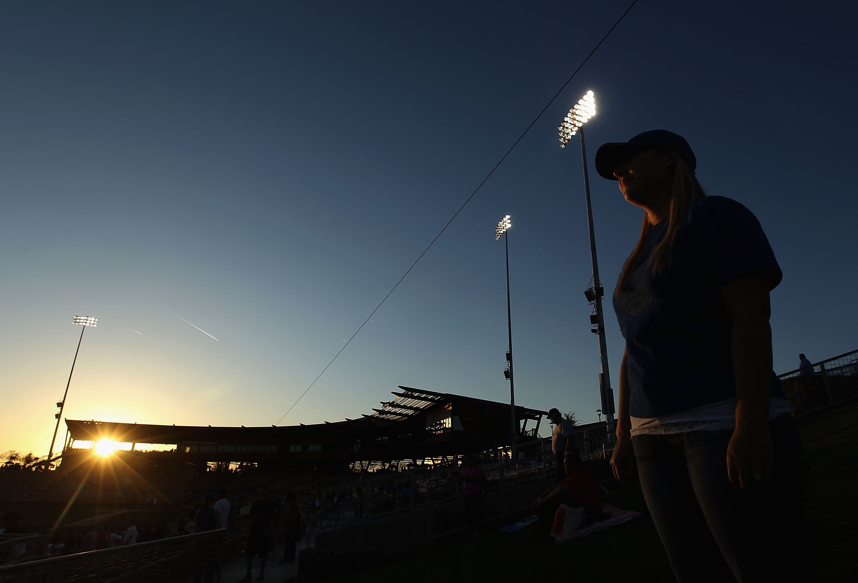 GLENDALE, AZ - MARCH 04:  A fan of the Los Angeles Dodgers stands in the outfield before the spring training game against the San Francisco Giants at Camelback Ranch on March 4, 2011 in Glendale, Arizona.  (Photo by Christian Petersen/Getty Images)