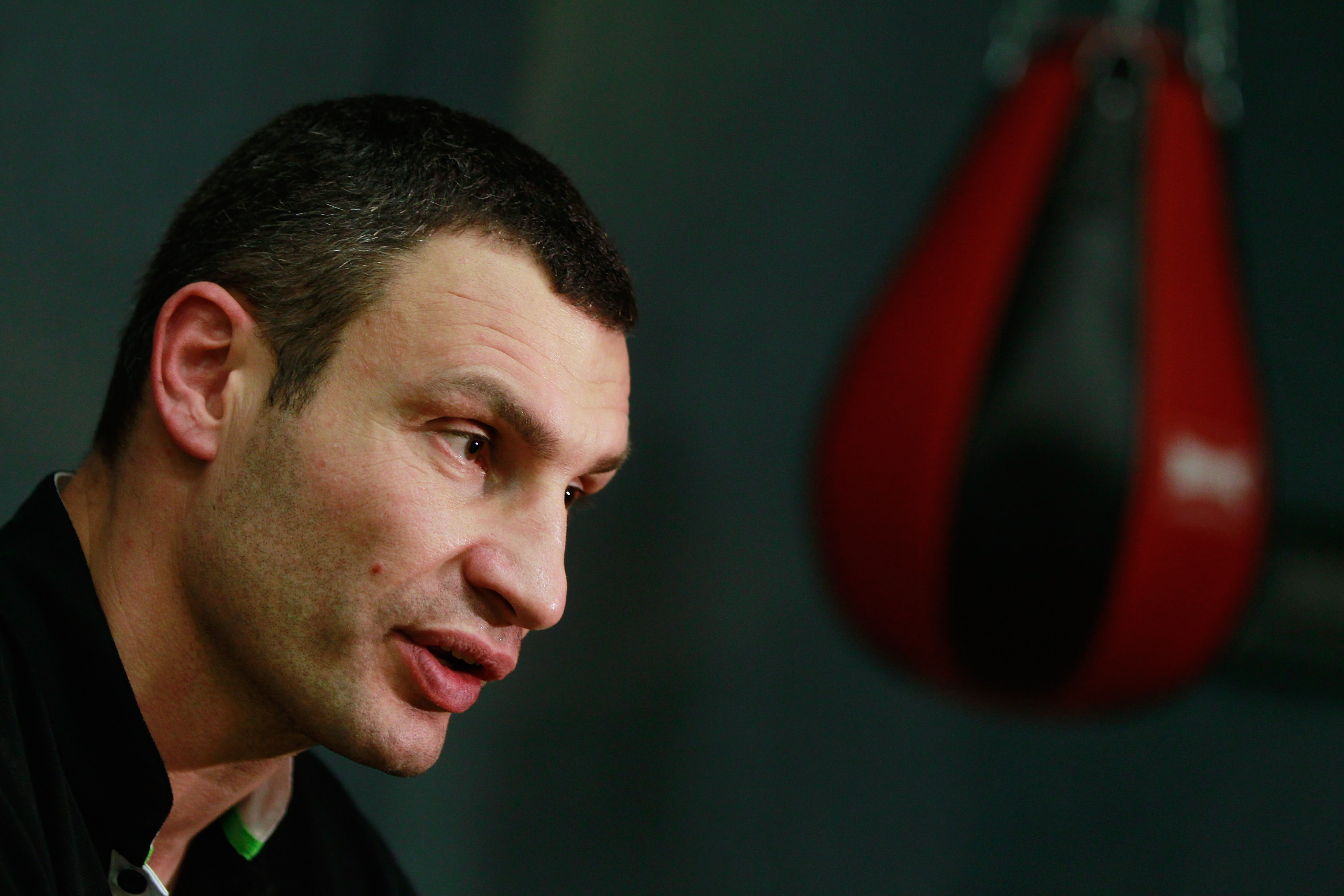 BERLIN - NOVEMBER 16: Pro boxer Vitali Klitschko gives a televison interview after coaching young boxers at the 'Kick im Boxring' at the TC Gruen Weiss boxing hall in Treptow district on November 16, 2010 in Berlin, Germany. The 'Kick im Boxring' project