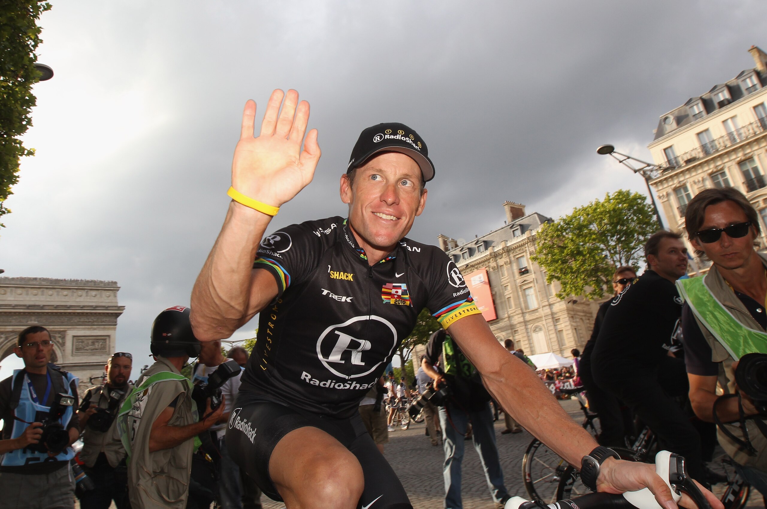 PARIS - JULY 25: Lance Armstrong of team Radioshack waves to fans after the twentieth and final stage of Le Tour de France 2010, from Longjumeau to the Champs-Elysees in Paris on July 25, 2010 in Paris, France. (Photo by Bryn Lennon/Getty Images) PARIS - JULY 25: Lance Armstrong of team Radioshack waves to fans after the twentieth and final stage of Le Tour de France 2010, from Longjumeau to the Champs-Elysees in Paris on July 25, 2010 in Paris, France. (Photo by Bryn Lennon/Getty Images)
