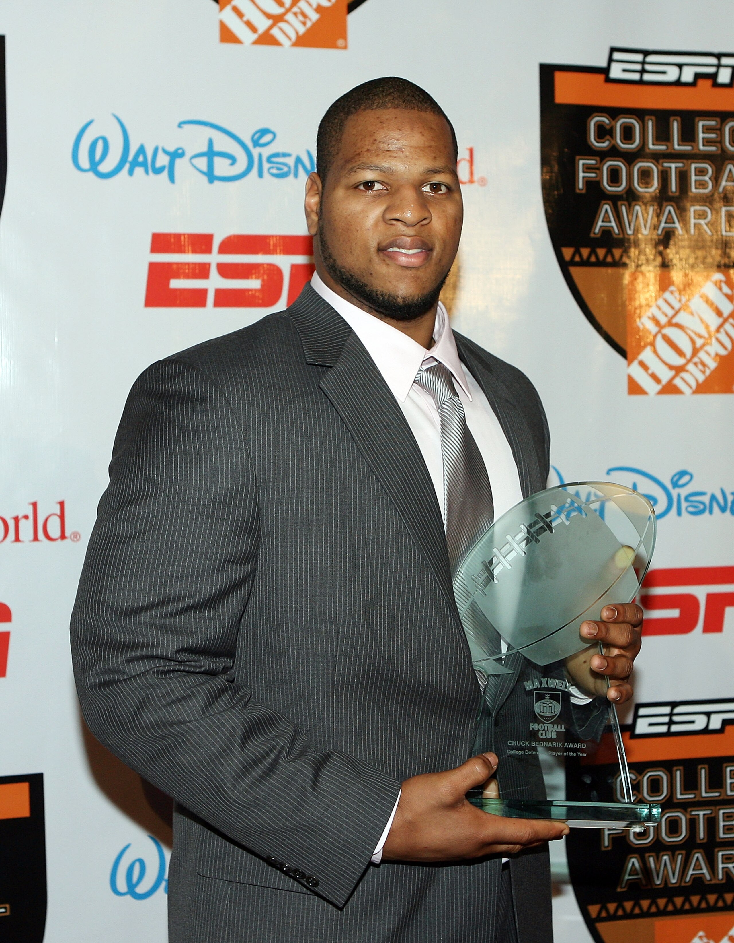 LAKE BUENA VISTA, FL - DECEMBER 10:  Defensive lineman Ndamukong Suh of the Nebraska Cornhuskers poses with the Chuck Bednarik Award trophy during the Home Depot ESPNU College Football Awards at the Disney Boardwalk on December 10, 2009 in Lake Buena Vist