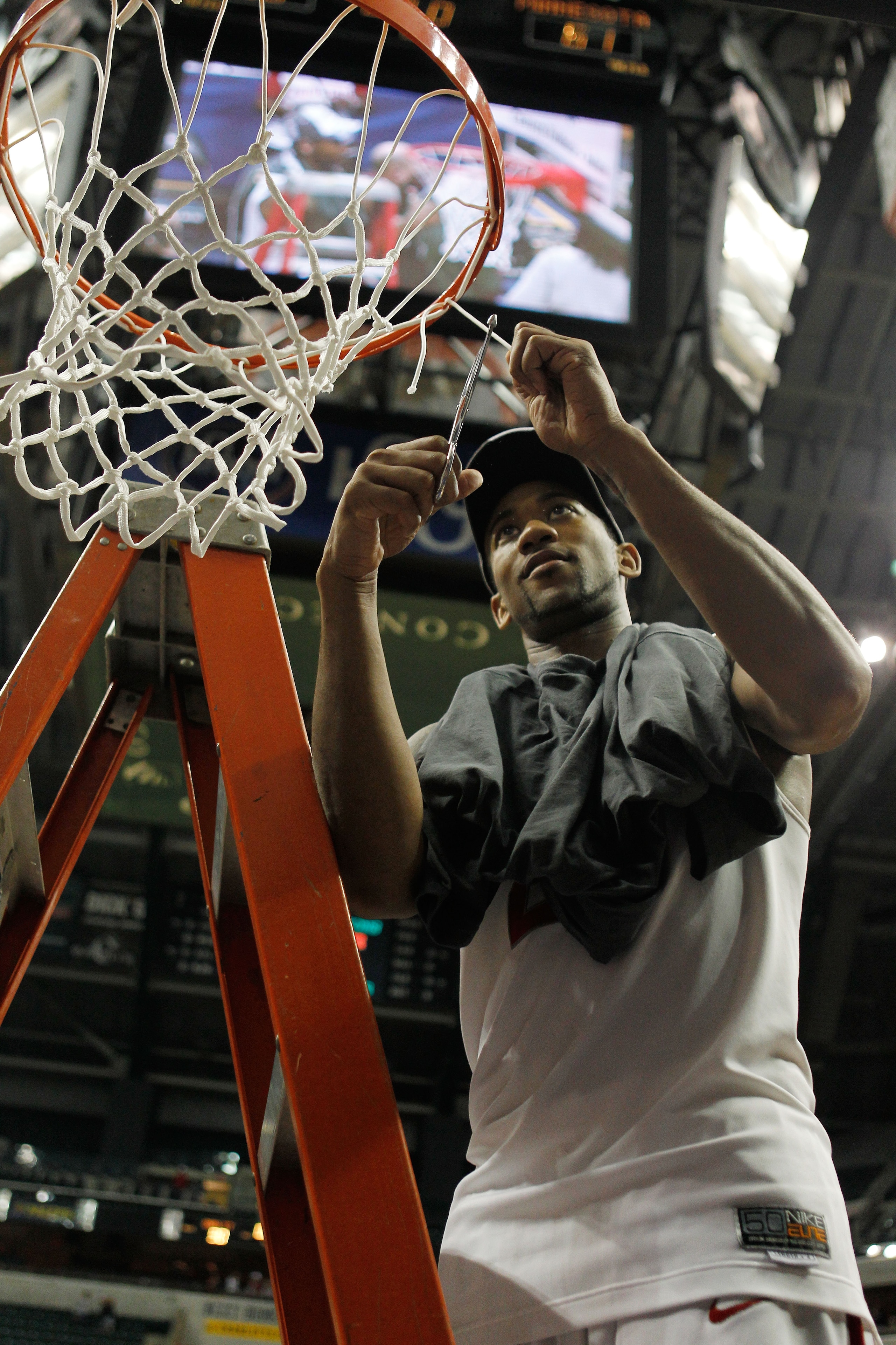 INDIANAPOLIS - MARCH 14:  Guard David Lighty #23 of the Ohio State Buckeyes cuts down the net after winning the championship game in the Big Ten Men's Basketball Tournament 90-61 over the Minnesota Golden Gophers at Conseco Fieldhouse on March 14, 2010 in