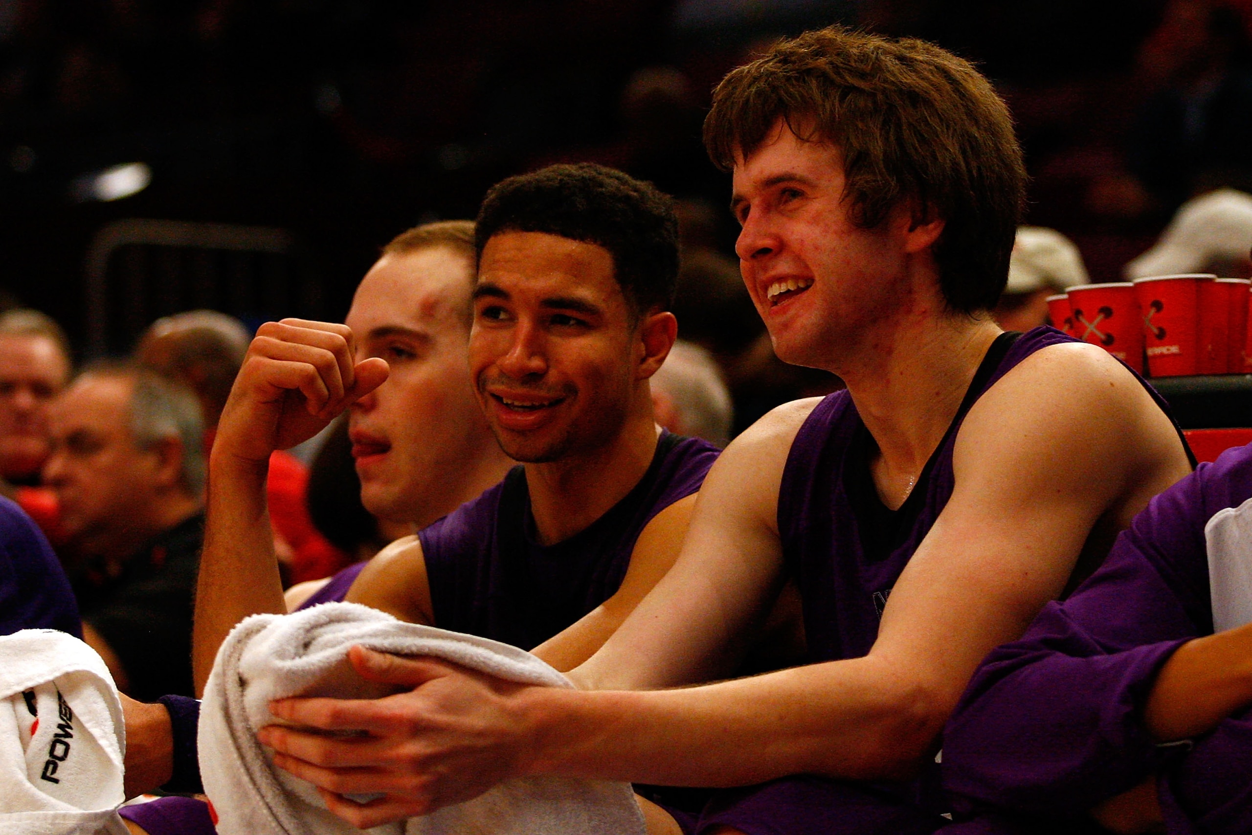 NEW YORK, NY - DECEMBER 20:  (L-R) Drew Crawford #1 and John Shurna #24 of the Northwestern Wildcats share a laugh on the bench late in the second half against the St. Francis Terriers during the Madison Square Garden Holiday Festival at Madison Square Ga