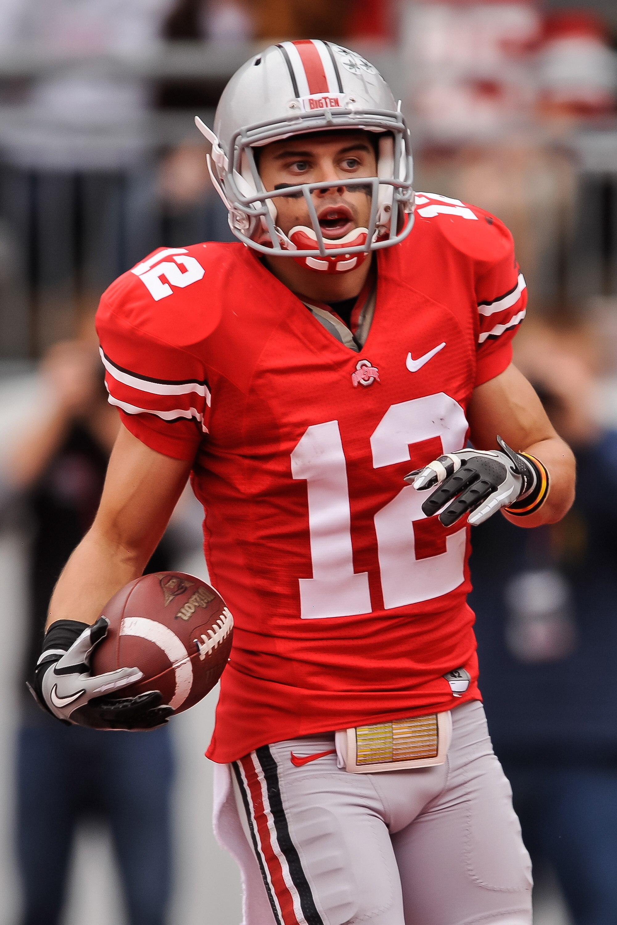 COLUMBUS, OH - OCTOBER 23:  Dane Sanzenbacher #12 of the Ohio State Buckeyes scores a touchdown against the Purdue Boilermakers at Ohio Stadium on October 23, 2010 in Columbus, Ohio.  (Photo by Jamie Sabau/Getty Images)