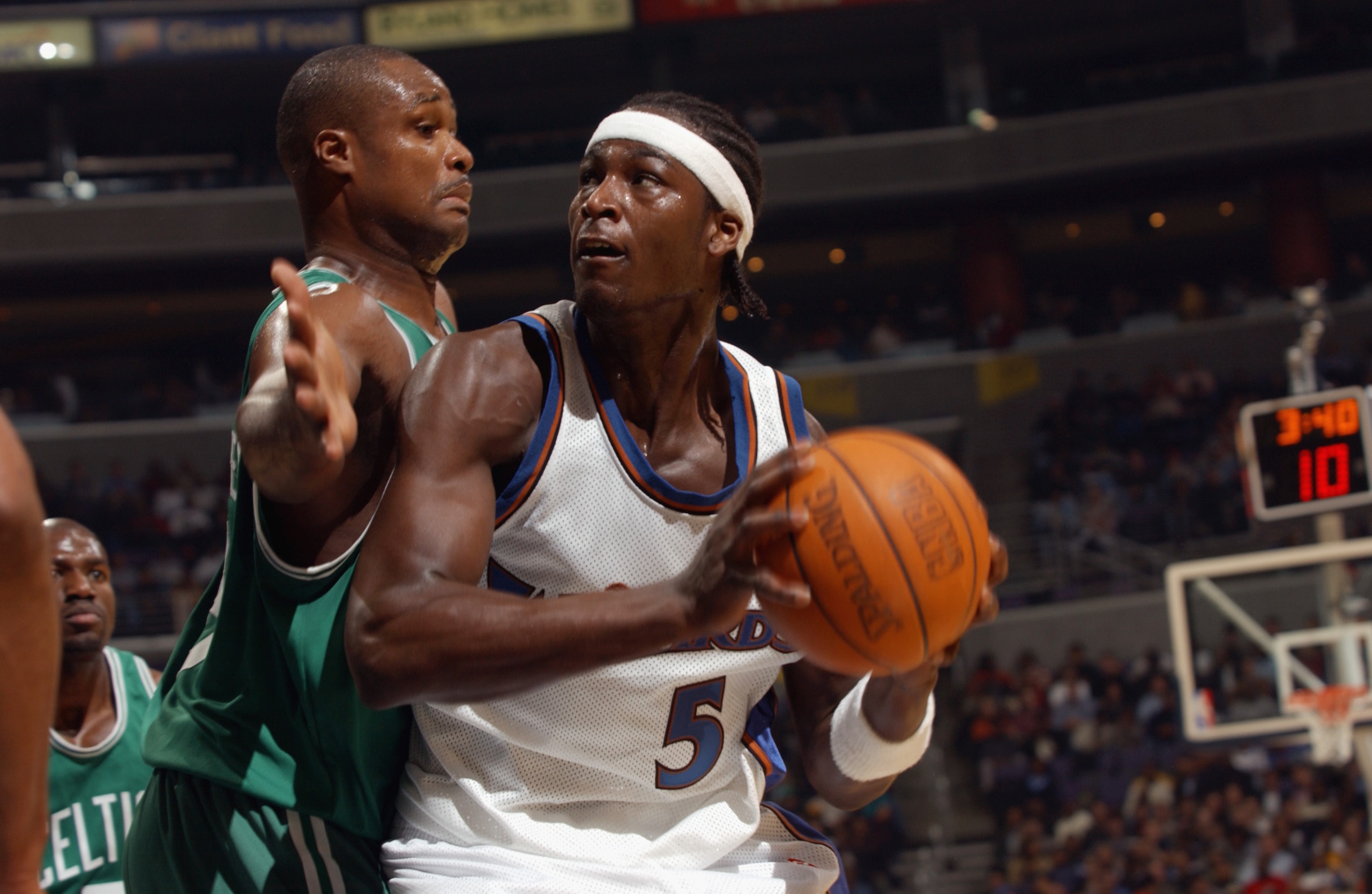 WASHINGTON - OCTOBER 31:  Kwame Brown #5 of the Washington Wizards is defended by Antoine Walker #8 of the Boston Celtics during the game at MCI Center on October 31, 2002 in Washington, D.C.  The Wizards won 114-69.  NOTE TO USER: User expressly acknowle