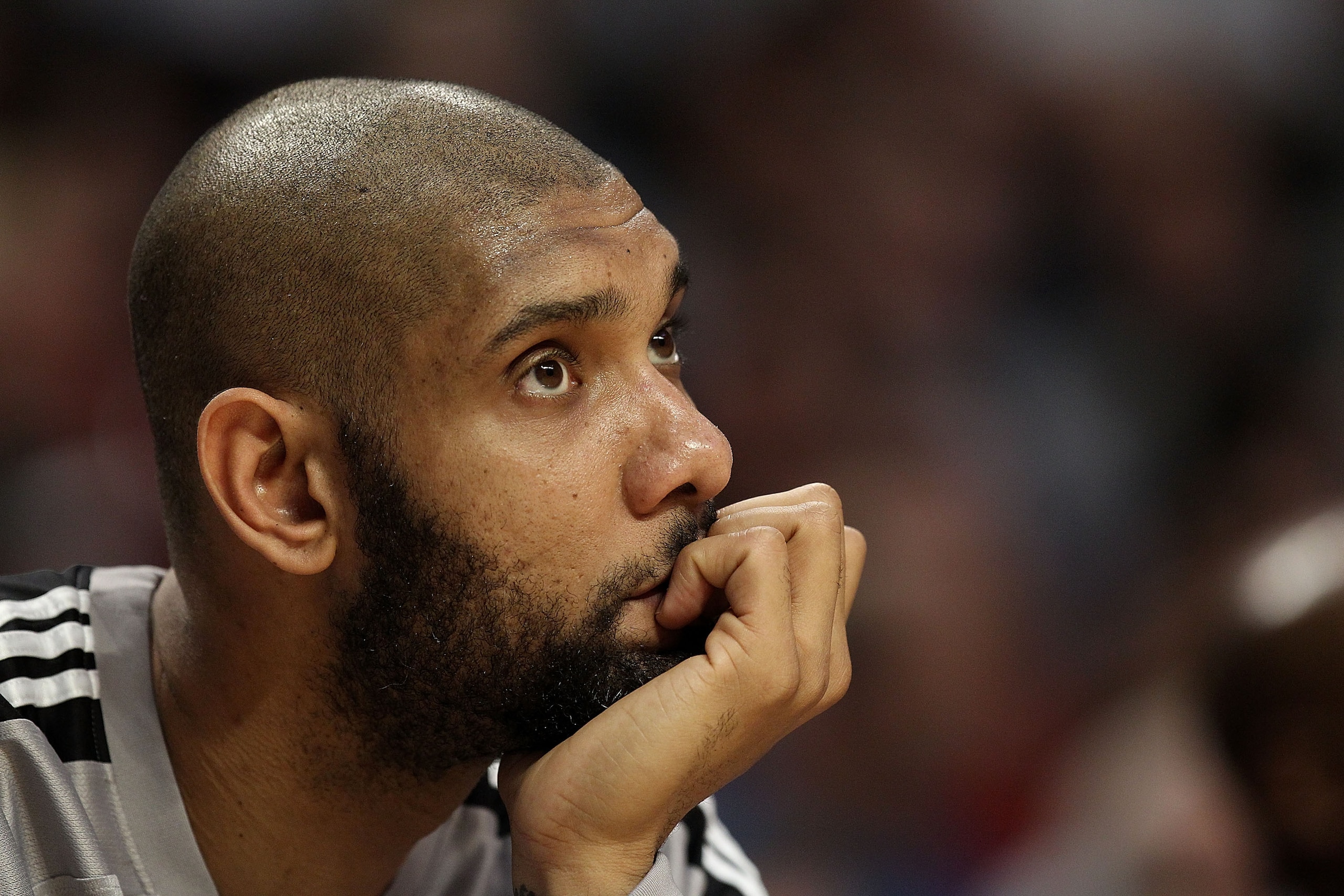 CHICAGO, IL - FEBRUARY 17: Tim Duncan #21 of the San Antonio Spurs watches from the bench as his teammates take on the Chicago Bulls at the United Center on February 17, 2011 in Chicago, Illinois. The Bulls defeated the Spurs 109-99. NOTE TO USER: User ex