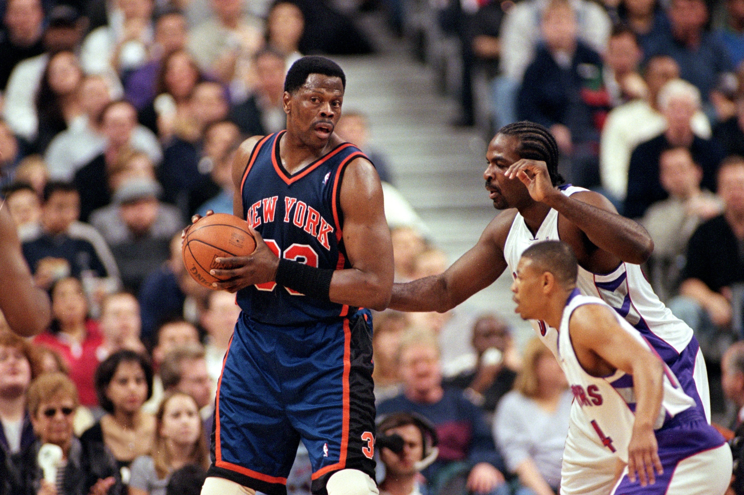 30 Apr 2000:  Patrick Ewing #33 of the New York Knicks with the ball as Charles Oakley #34 of the Toronto Raptors during the NBA Eastern Conference Round One Game at the Air Canada Centre in Toronto, Ontario, Canada. The Knicks defeated the Raptors 87-80.