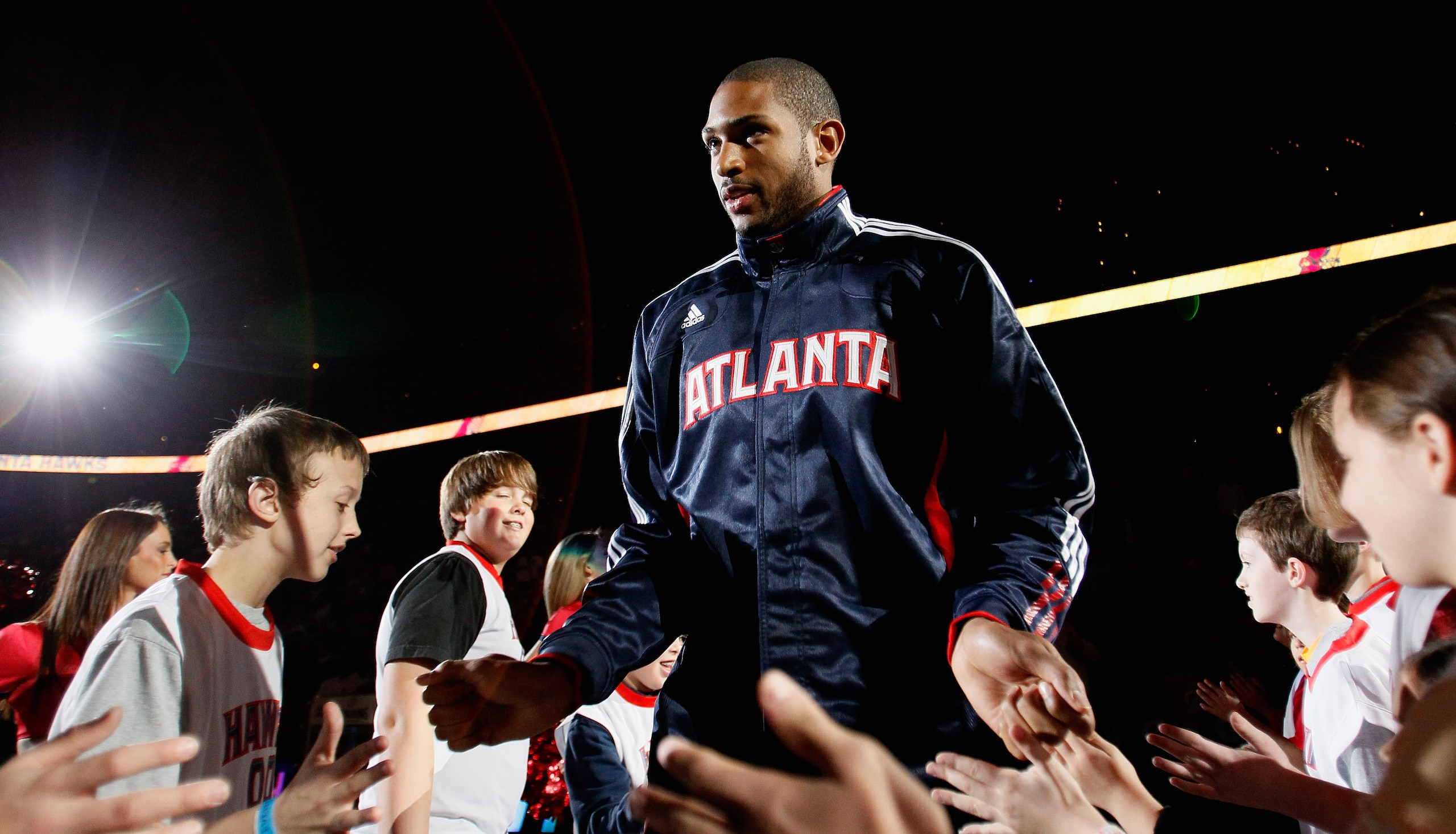 ATLANTA, GA - MARCH 08:  Al Horford #15 of the Atlanta Hawks enters the court during introductions before facing the Los Angeles Lakers at Philips Arena on March 8, 2011 in Atlanta, Georgia.  NOTE TO USER: User expressly acknowledges and agrees that, by d