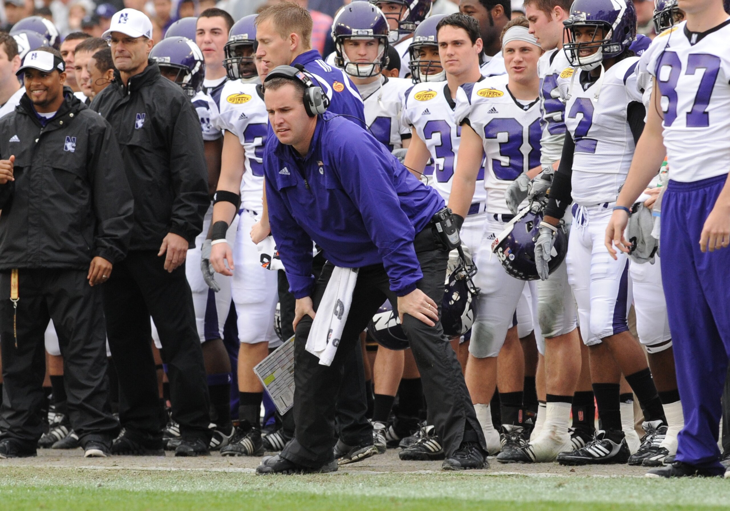 TAMPA, FL - JANUARY 1: Coach Pat Fitzgerald of the Northwestern Wildcats directs play against the Auburn Tigers in the Outback Bowl January 1, 2010 at Raymond James Stadium in Tampa, Florida. (Photo by Al Messerschmidt/Getty Images) TAMPA, FL - JANUARY 1: Coach Pat Fitzgerald of the Northwestern Wildcats directs play against the Auburn Tigers in the Outback Bowl January 1, 2010 at Raymond James Stadium in Tampa, Florida. (Photo by Al Messerschmidt/Getty Images)