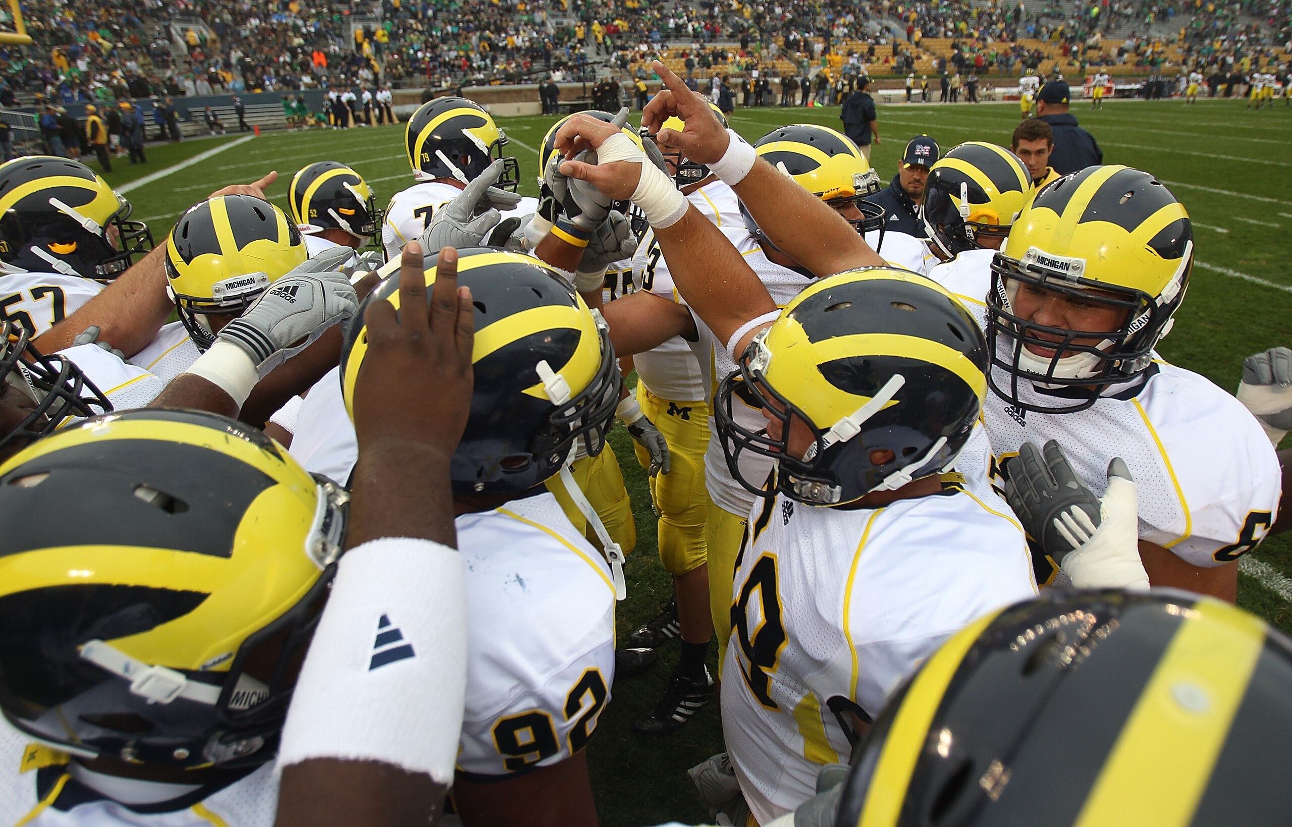 SOUTH BEND, IN - SEPTEMBER 11: Members of the Michigan Wolverines get ready during warm-ups to play against the Notre Dame Fighting Irish at Notre Dame Stadium on September 11, 2010 in South Bend, Indiana. Michigan defeated Notre Dame 28-24. (Photo by Jo SOUTH BEND, IN - SEPTEMBER 11: Members of the Michigan Wolverines get ready during warm-ups to play against the Notre Dame Fighting Irish at Notre Dame Stadium on September 11, 2010 in South Bend, Indiana. Michigan defeated Notre Dame 28-24. (Photo by Jo