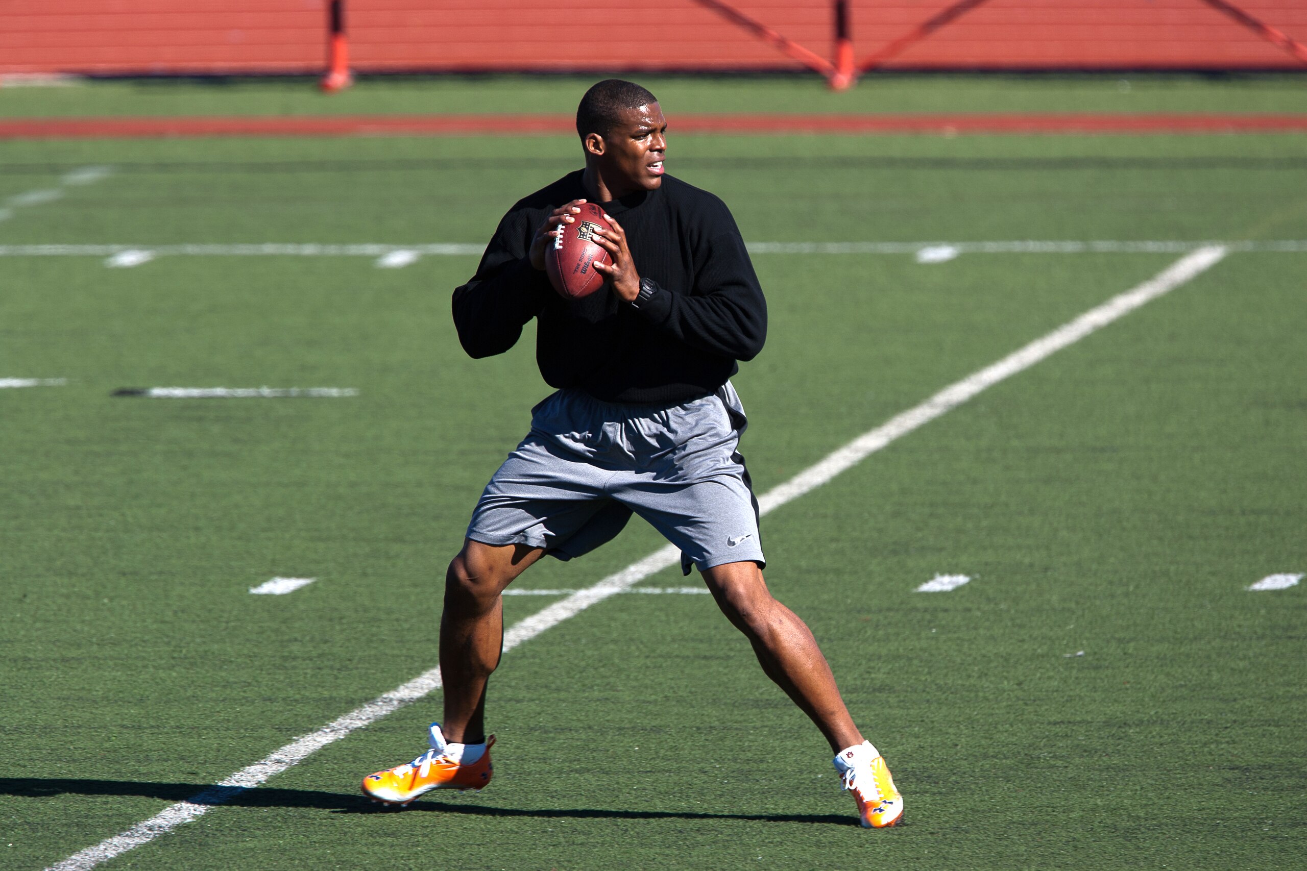 SAN DIEGO, CA - FEBRUARY 10:  2010 Heisman Trophy winning quarterback Cam Newton of the Auburn Tigers goes through his workout routine for the media at Cathedral High School's sports stadium on February 10, 2011 in San Diego, California.  (Photo by Kent H