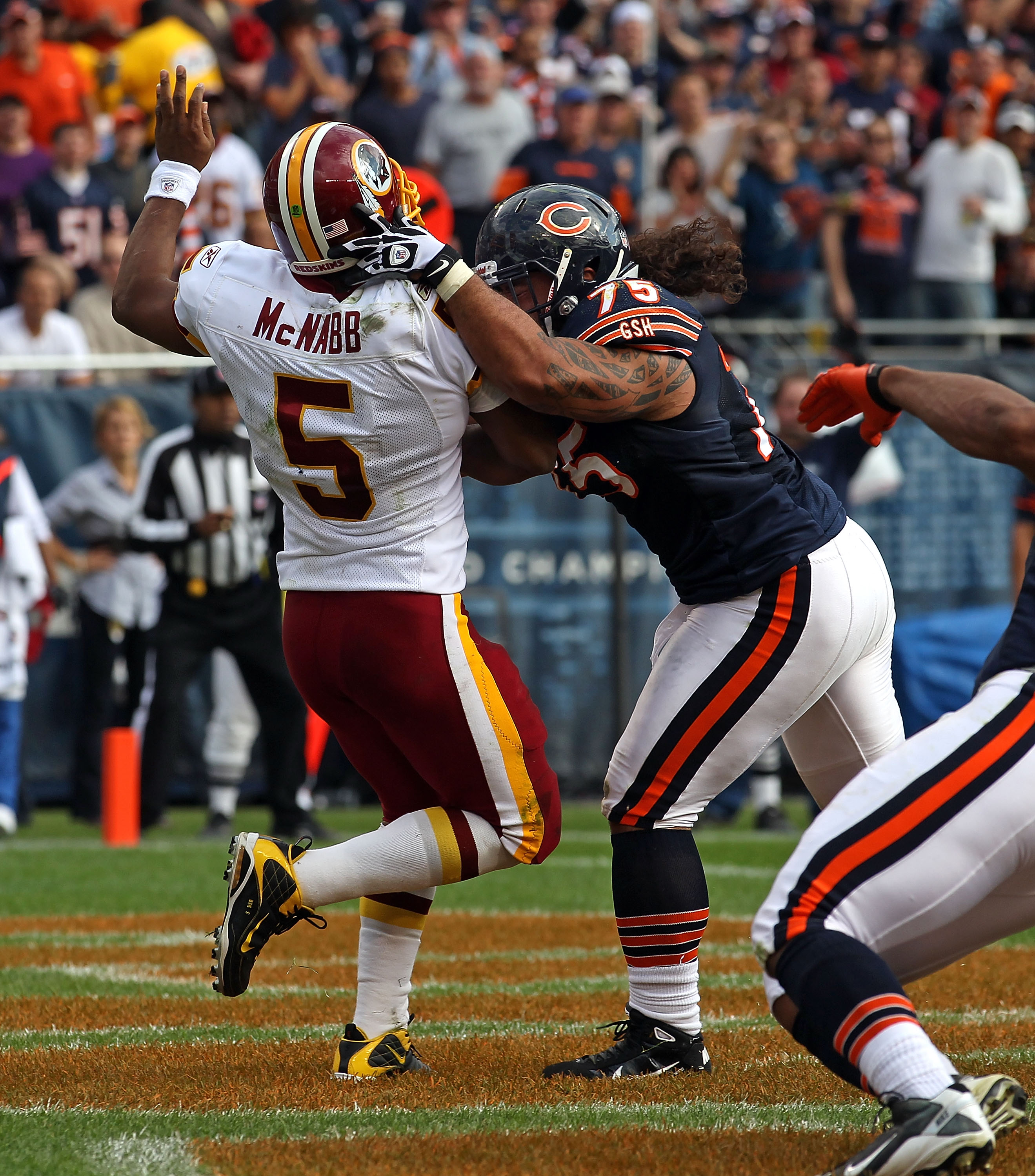 CHICAGO - OCTOBER 24: Matt Toeaina #75 of the Chicago Bears hits Donovan McNabb #5 of the Washington Redskins after a pass at Soldier Field on October 24, 2010 in Chicago, Illinois. The Redskins defeated the Bears 17-14. (Photo by Jonathan Daniel/Getty Im
