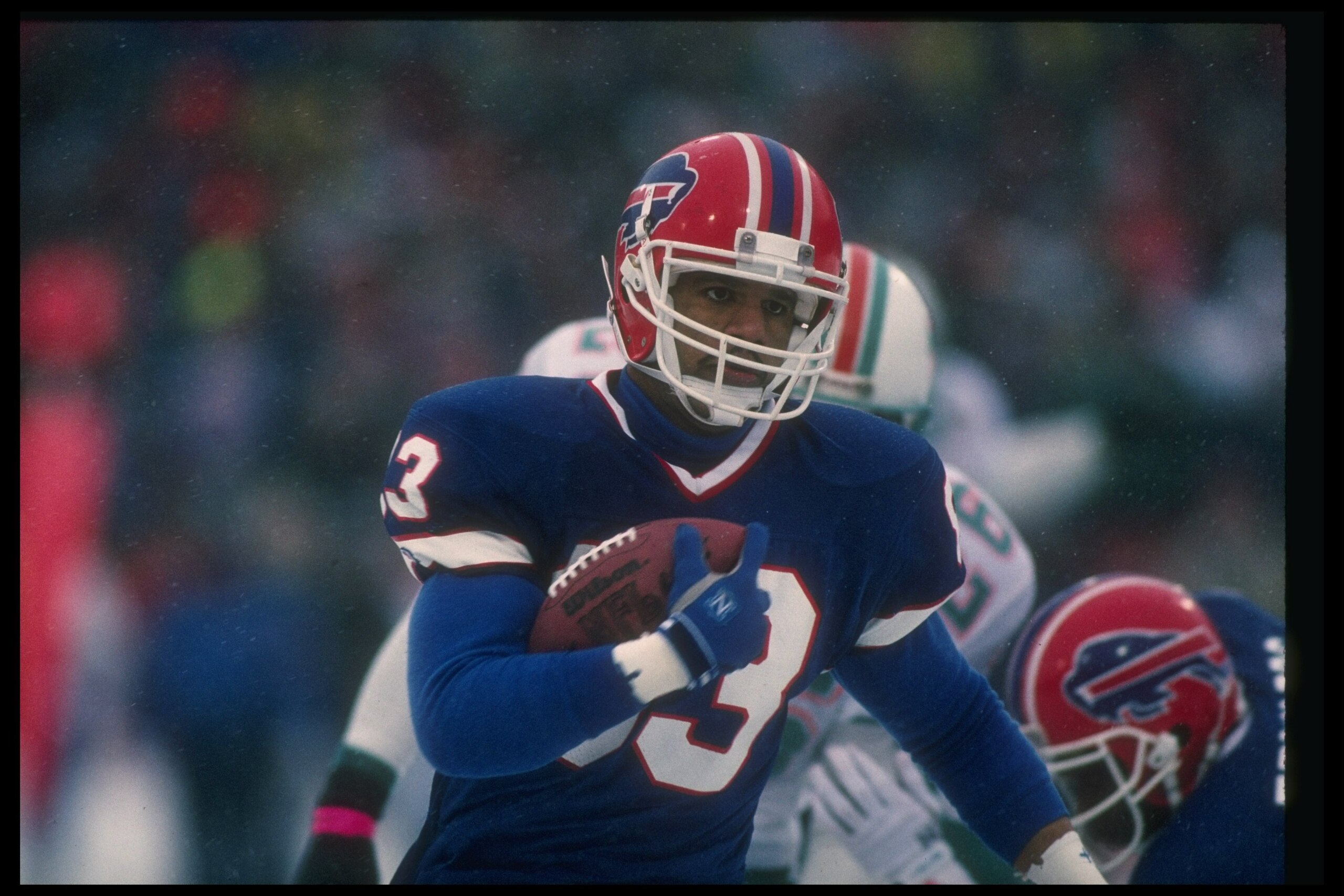 12 Jan 1991:  Wide receiver Andre Reed of the Buffalo Bills runs with the ball during a playoff game against the Miami Dolphins at Rich Stadium in Orchard Park, New York.  The Bills won the game, 44-34. Mandatory Credit: Rick Stewart  /Allsport