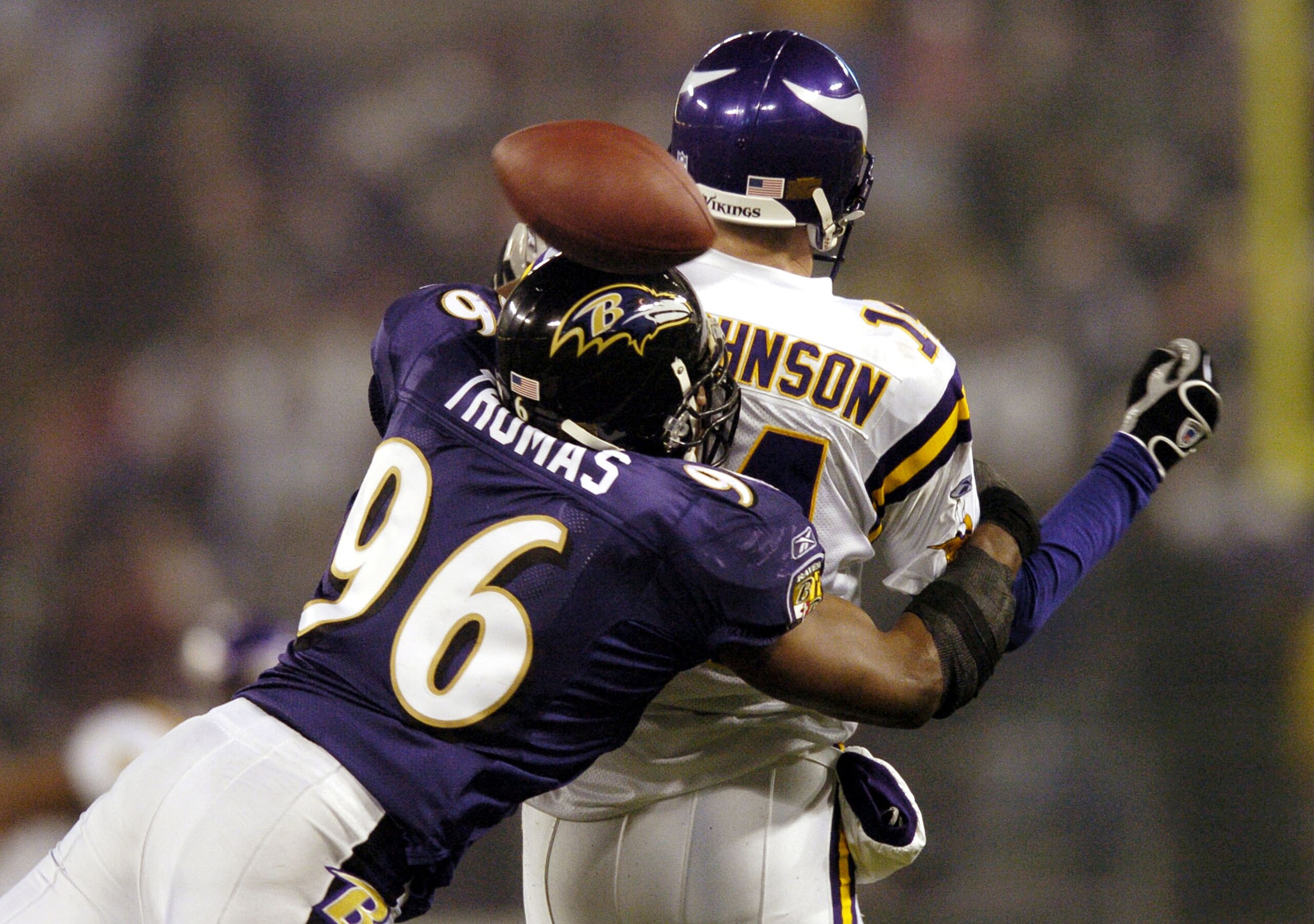 BALTIMORE - DECEMBER 25:  Brad Johnson #14 of the Minnesota Vikings fumbles as he is sacked by Adalius Thomas #96 of the Baltimore Ravens during the fourth quarter on December 25, 2005 M&T Bank Stadium in Baltimore, Maryland. The Ravens won 30-23.  (Photo