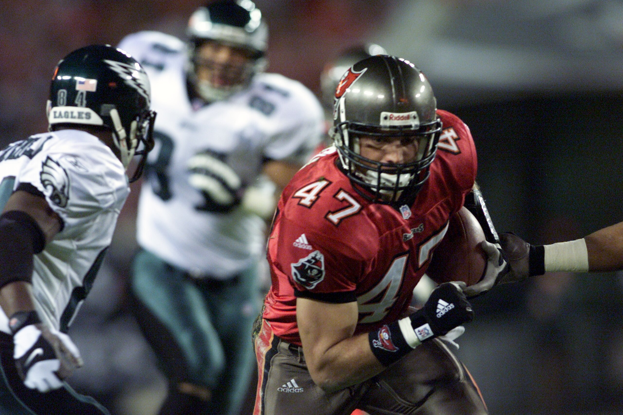 06 Jan 2002: John Lynch #47 of the Tampa Bay Buccaneers rushes past Freddie Mitchell #84 of the Philadelphia Eagles during the game at Raymond James Stadium in Tampa Bay, Florida. The Eagles defeated the Buccaneers 17-13. DIGITAL IMAGE. Mandatory Credit:
