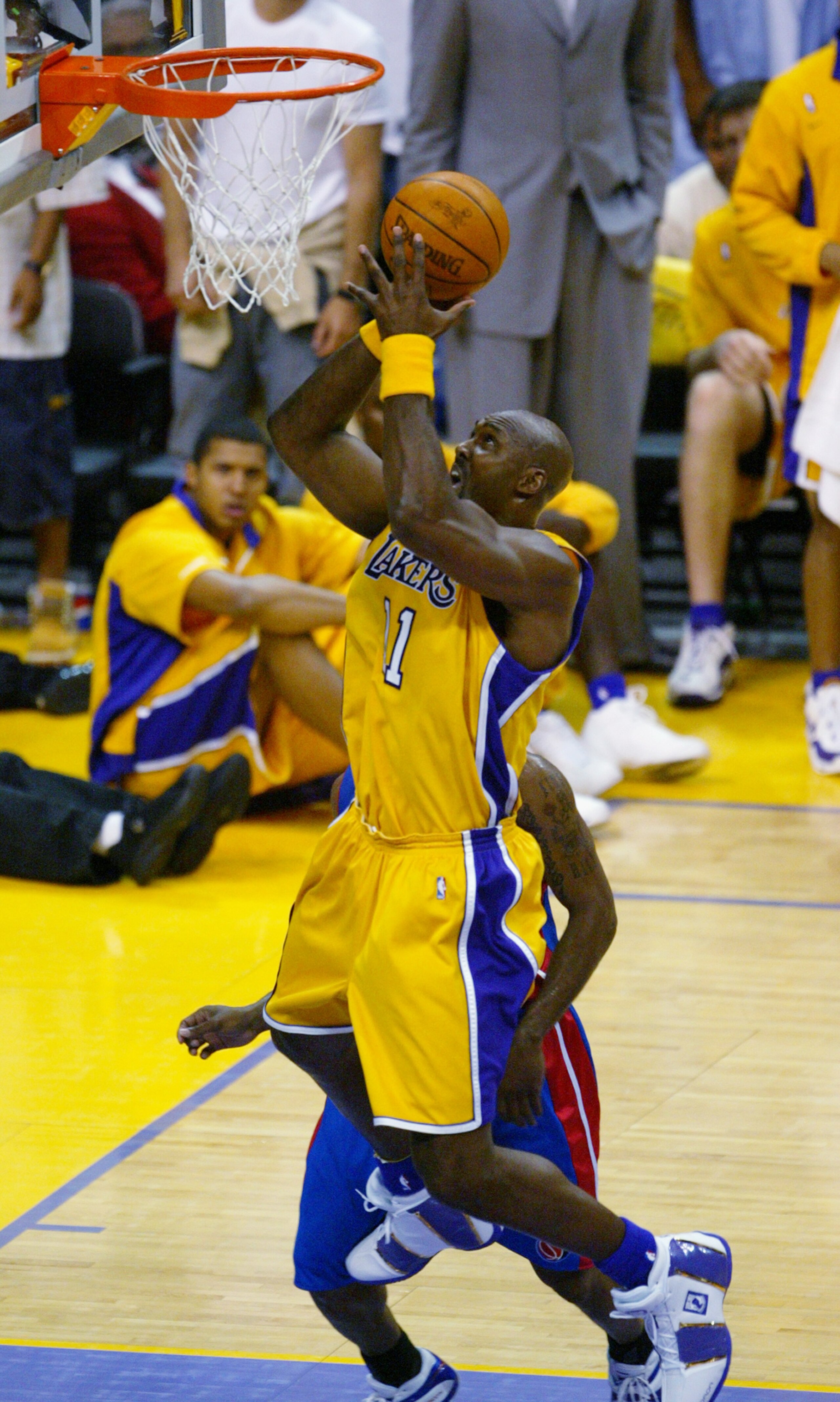 LOS ANGELES - JUNE 8:  Karl Malone #11 of the Los Angeles Lakers shoots against the Detroit Pistons in Game two of the 2004 NBA Finals at Staples Center on June 8, 2004 in Los Angeles, California.  The Lakers won in overtime 99-91.  NOTE TO USER: User exp