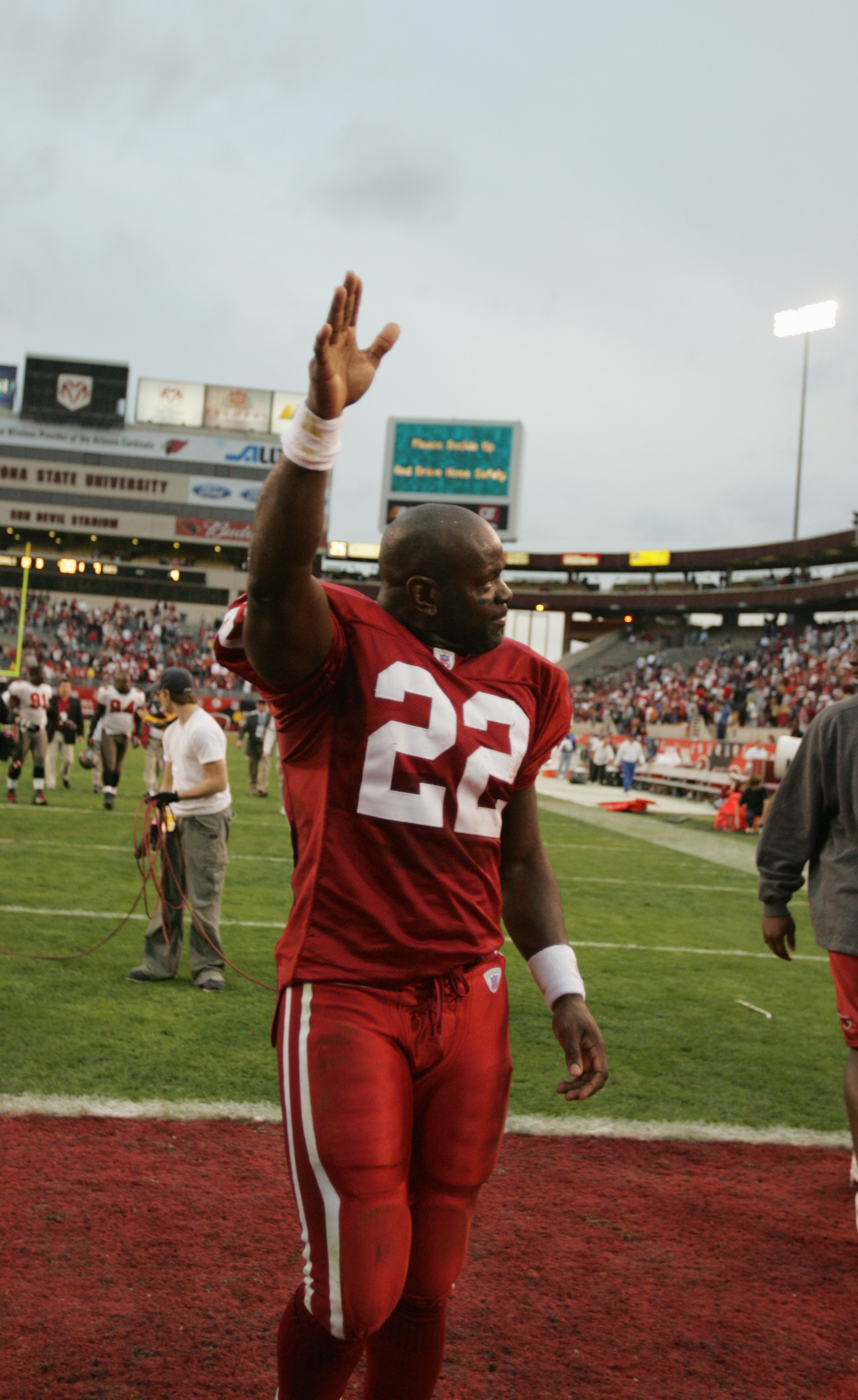 TEMPE, AZ - JANUARY 2:  Running back Emmitt Smith #22 of the Arizona Cardinals waves to the fans as he leaves the field after the game against the Tampa Bay Buccaneers at Sun Devil Stadium on January 2, 2005 in Tempe, Arizona. The Cardinals defeated the B