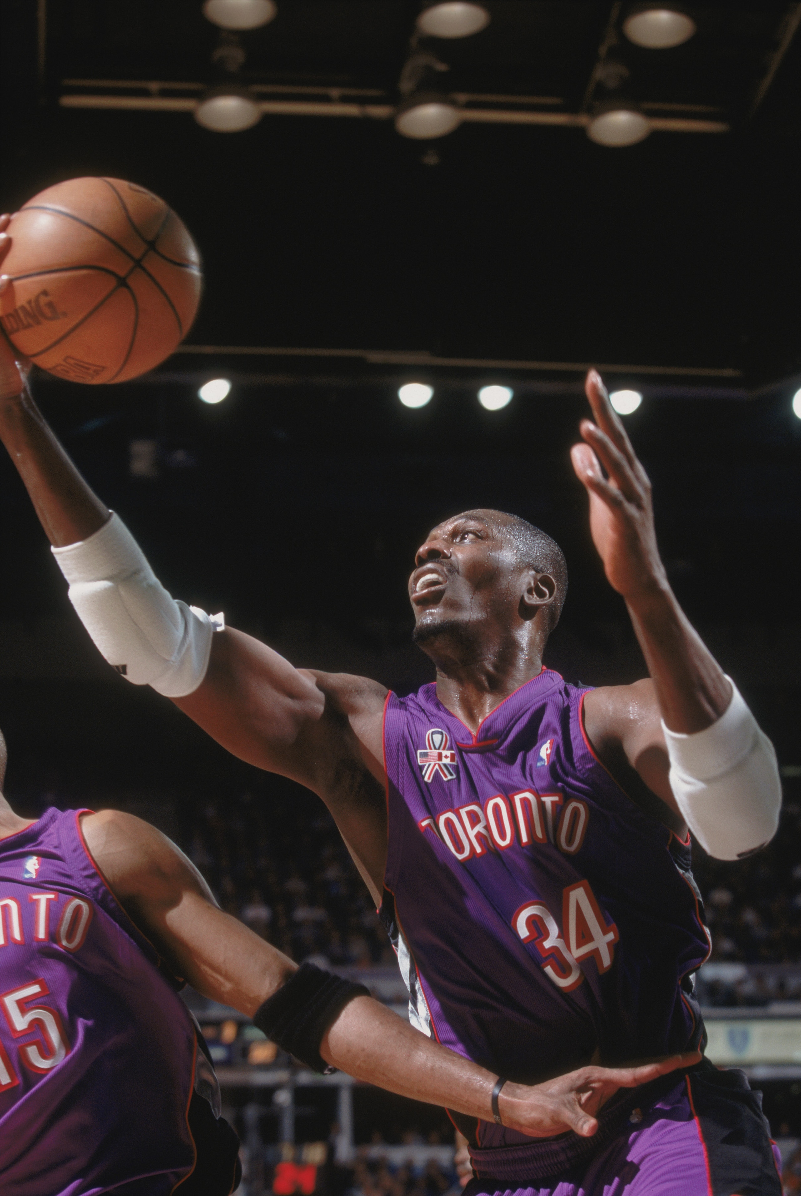 14 Nov 2001:  Center Hakeem Olajuwon #34 of the Toronto Raptors grabs the ball against the Sacramento Kings during the NBA game at Arco Arena in Sacramento, California. The Kings defeated the Raptors 95-86. NOTE TO USER:  User expressly acknowledges and a