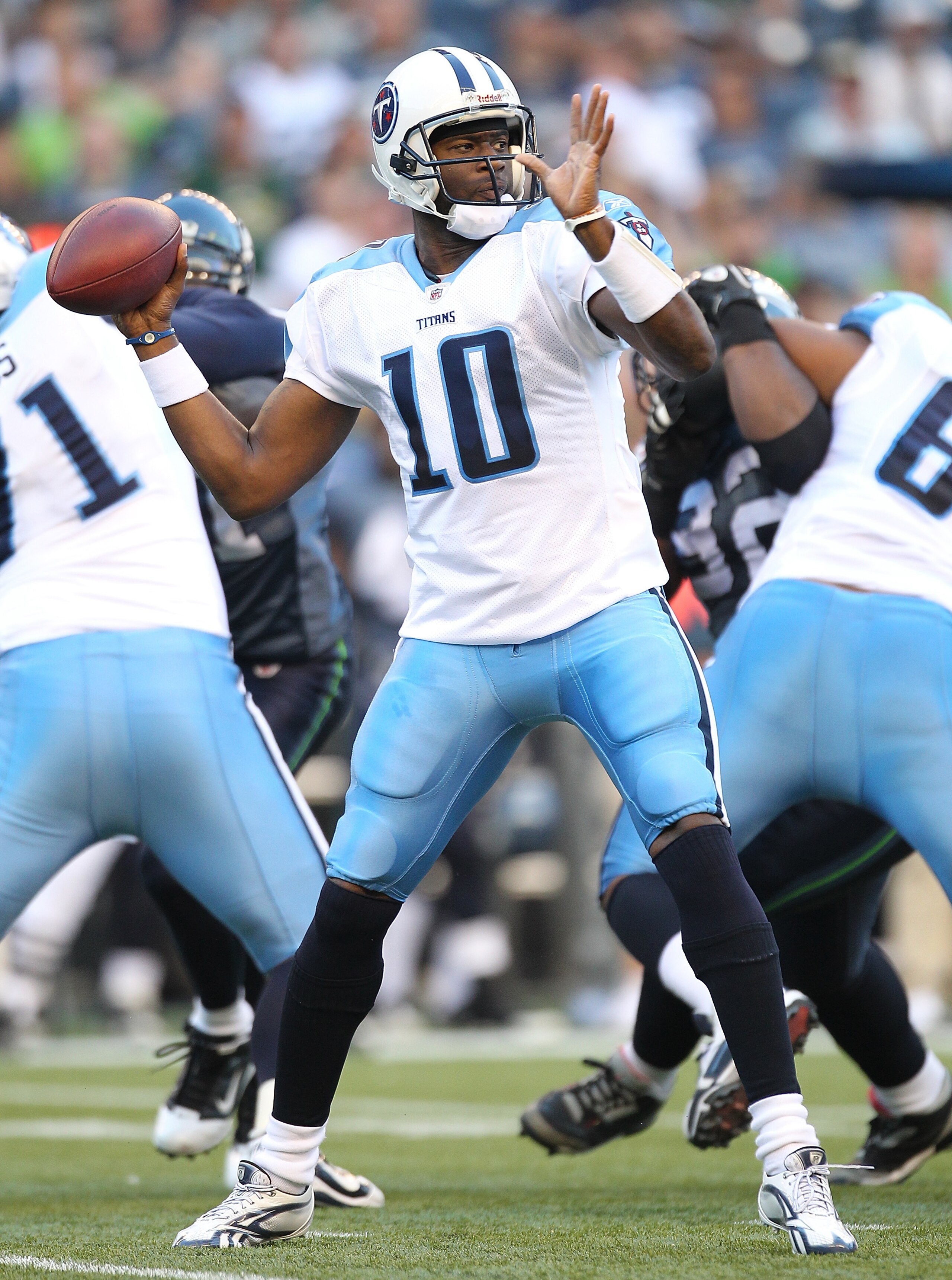 SEATTLE - AUGUST 14:  Quarterback Vince Young #10 of the Tennessee Titans passes during the preseason game against the Seattle Seahawks at Qwest Field on August 14, 2010 in Seattle, Washington. (Photo by Otto Greule Jr/Getty Images)