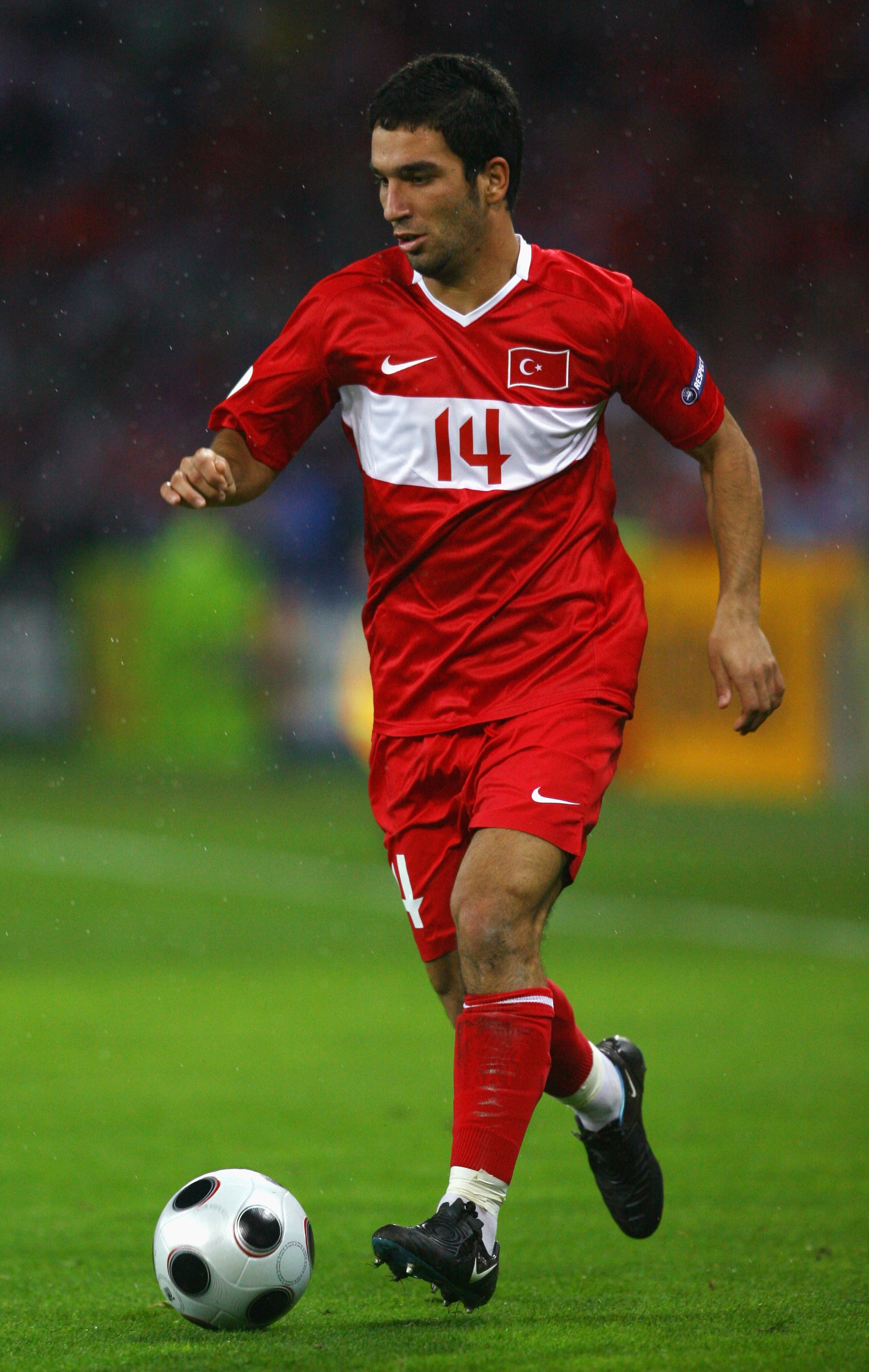 GENEVA - JUNE 15:  Arda Turan of Turkey in action during the UEFA EURO 2008 Group A match between Turkey and Czech Republic at Stade de Geneve on June 15, 2008 in Geneva, Switzerland.  (Photo by Shaun Botterill/Getty Images)