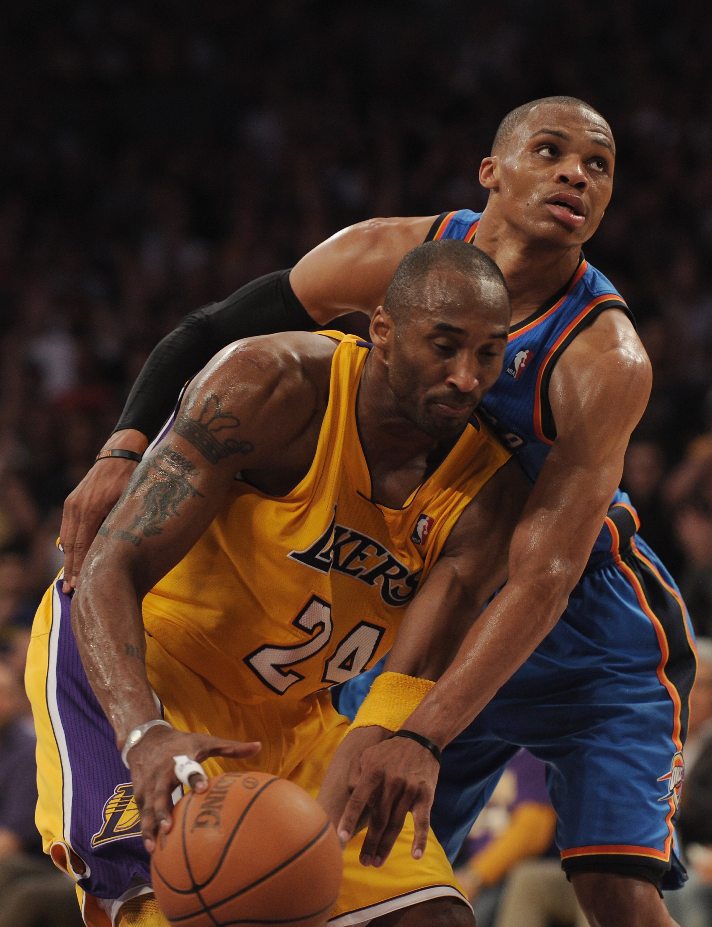 LOS ANGELES, CA - JANUARY 17:  Kobe Bryant #24 of the Los Angeles Lakers is fouled by Russell Westbrook #0 of the Oklahoma City Thunder during a 101-94 Laker win at the Staples Center on January 17, 2011 in Los Angeles, California.   NOTE TO USER: User ex