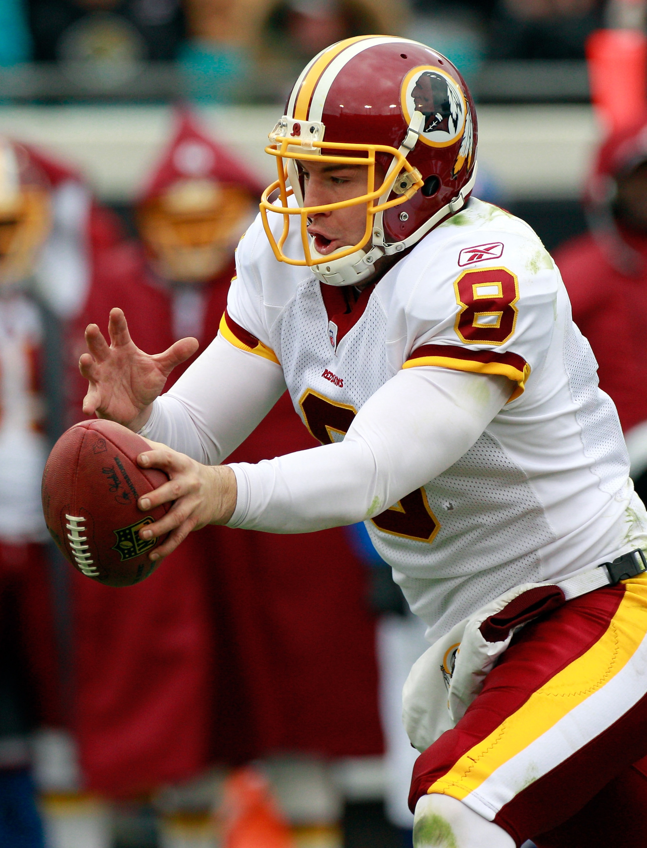 JACKSONVILLE, FL - DECEMBER 26:  Quarterback Rex Grossman #8 of the Washington Redskins attempts to make a hand off during the game against the Jacksonville Jaguars at EverBank Field on December 26, 2010 in Jacksonville, Florida.  (Photo by Sam Greenwood/