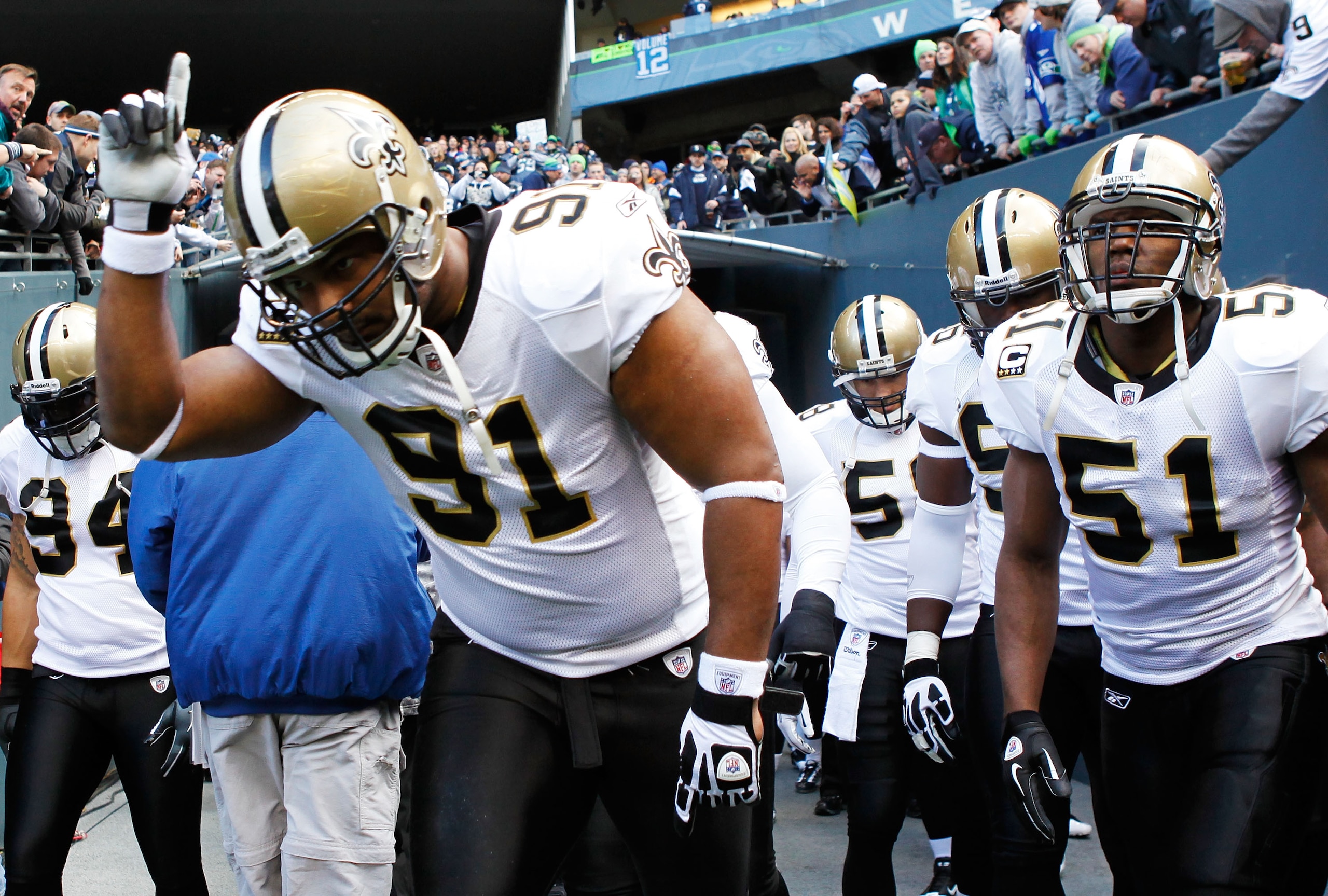 SEATTLE, WA - JANUARY 08:  Will Smith #91 and Jonathan Vilma #51 of the New Orleans Saints take the field against the Seattle Seahawks during the 2011 NFC wild-card playoff game at Qwest Field on January 8, 2011 in Seattle, Washington.  (Photo by Jonathan
