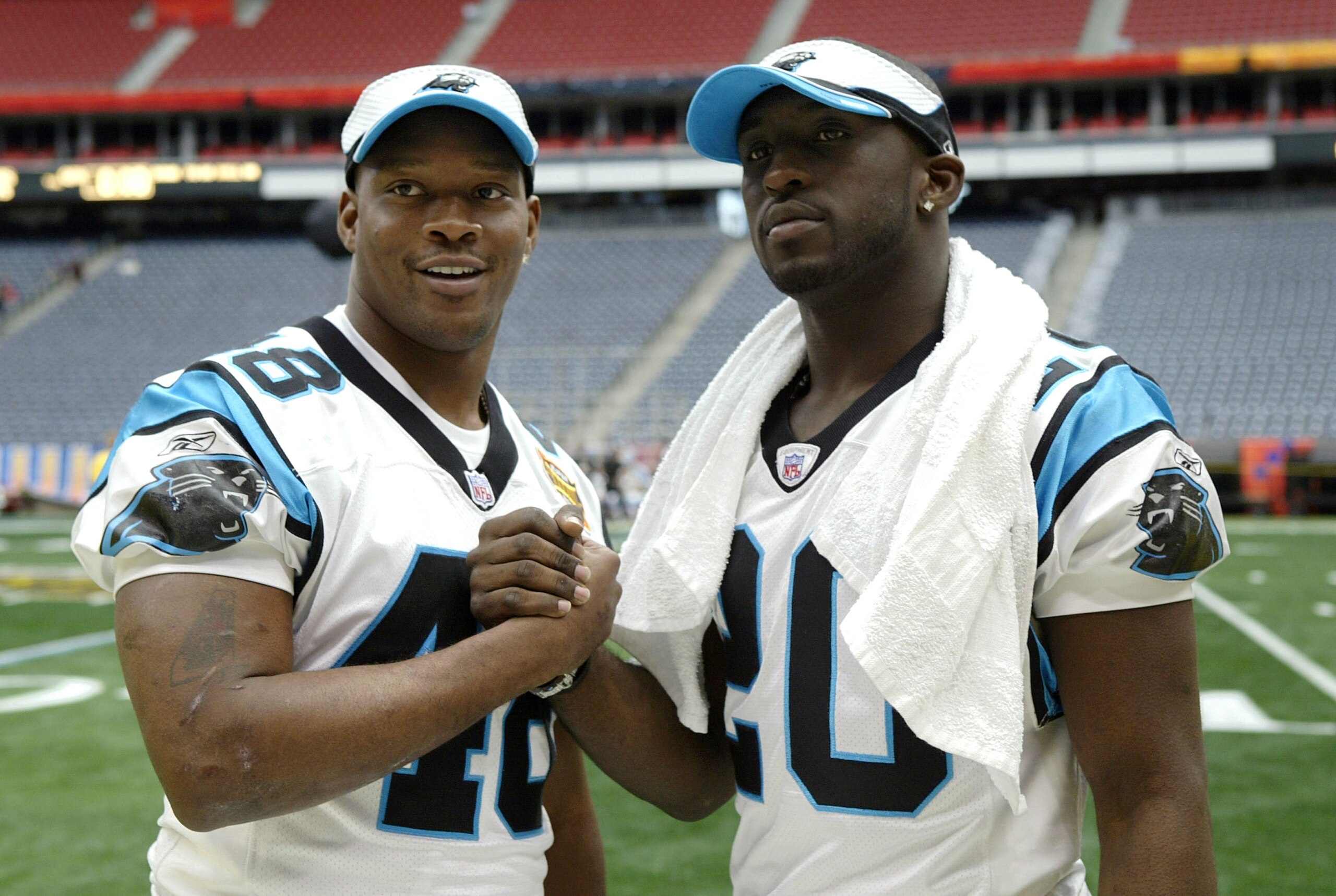 HOUSTON - JANUARY 27:  Running backs Stephen Davis #48 and DeShaun Foster #20 of the Carolina Panthers pose for a photo on media day January 26, 2003 at Reliant Stadium before Super Bowl XXXVIII against the New England Patriots in Houston, Texas.  (Photo