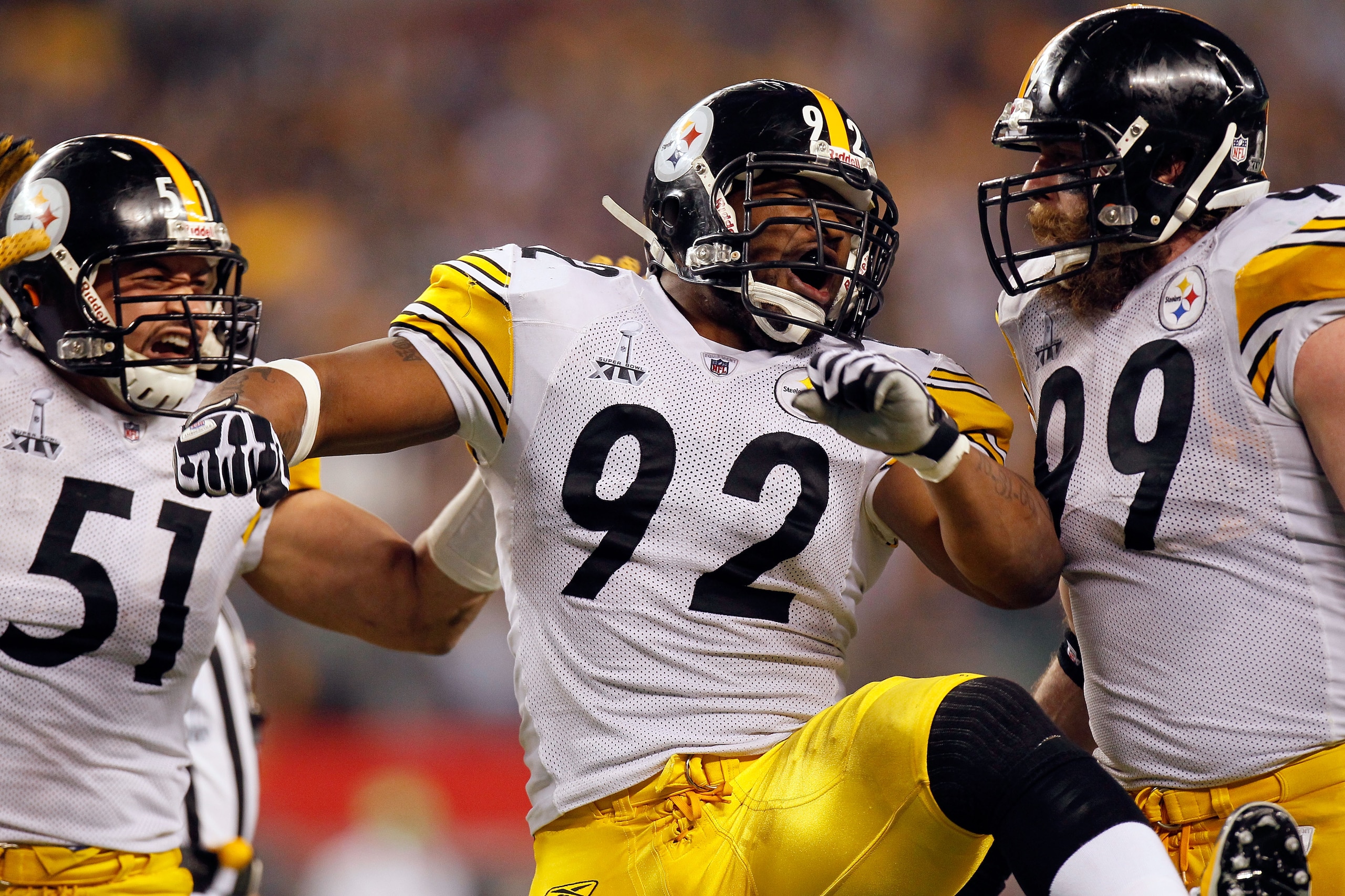 ARLINGTON, TX - FEBRUARY 06:  James Farrior #51, James Harrison #92 and Brett Keisel #99 of the Pittsburgh Steelers celebrate a defensive play against the Green Bay Packers during Super Bowl XLV at Cowboys Stadium on February 6, 2011 in Arlington, Texas.