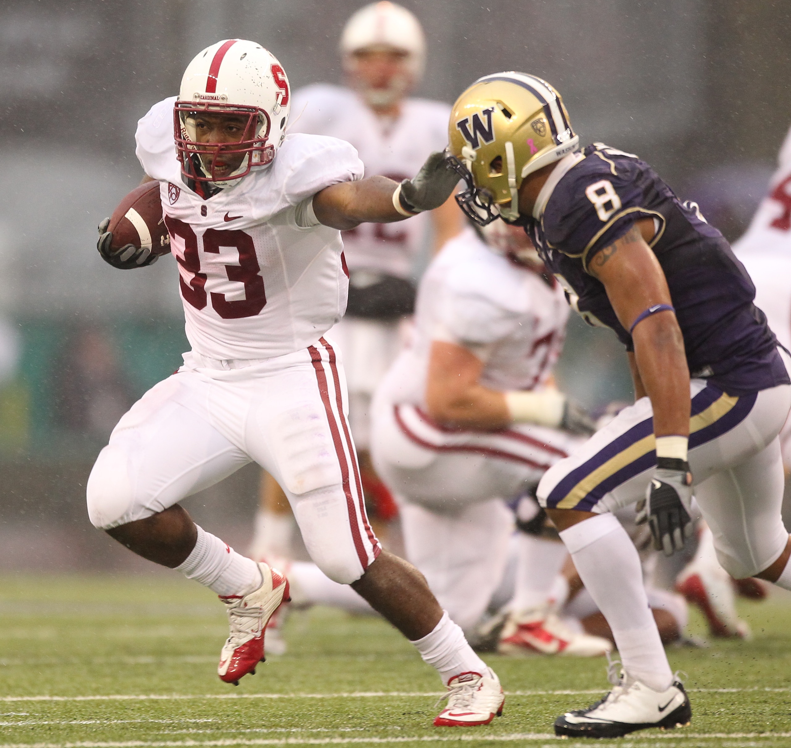 SEATTLE - OCTOBER 30:  Running back Stepfan Taylor #33 of the Stanford Cardinal rushes against Nate Williams #8 of the Washington Huskies on October 30, 2010 at Husky Stadium in Seattle, Washington. Stanford won 41-0. (Photo by Otto Greule Jr/Getty Images