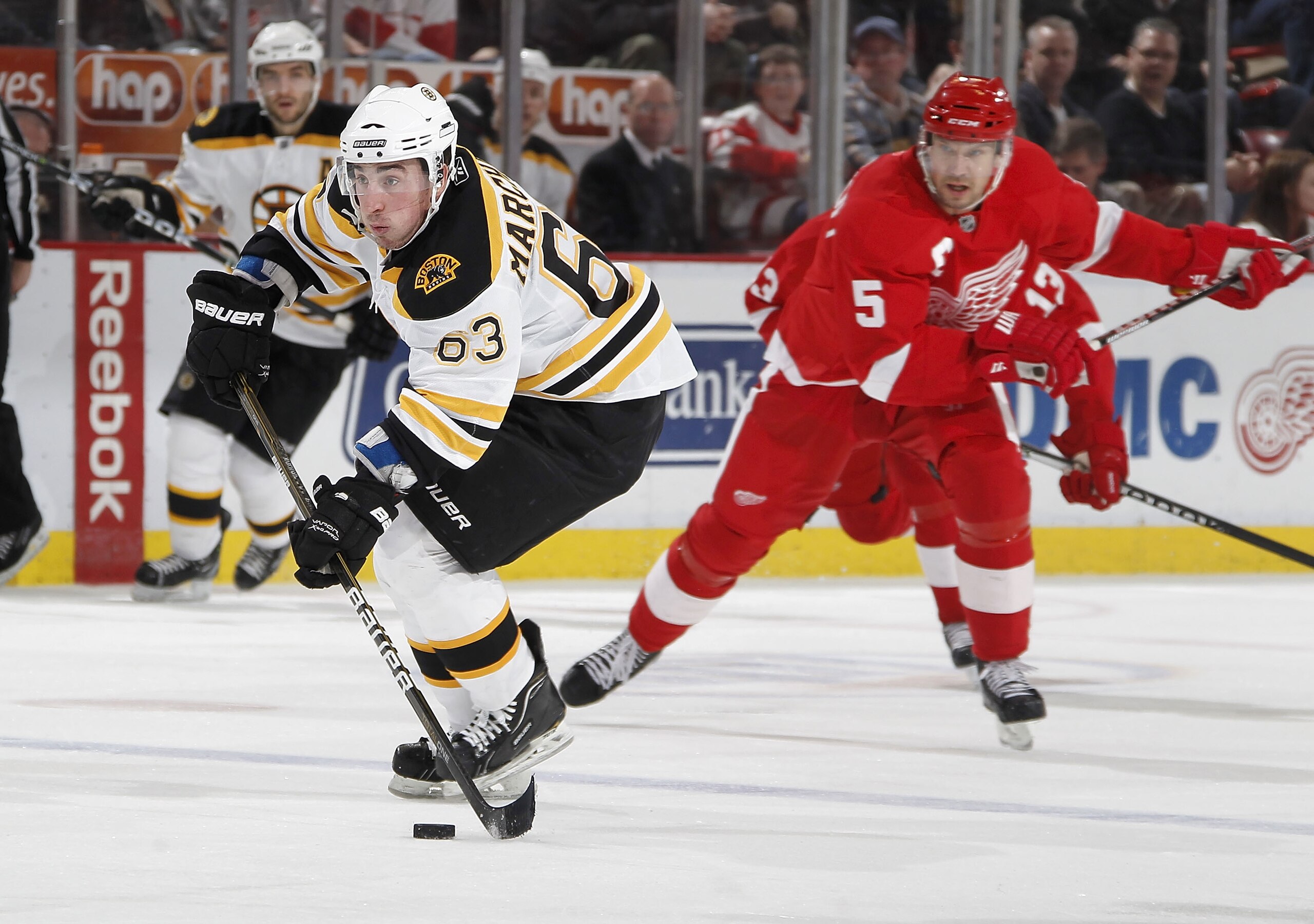 DETROIT, MI - FEBRUARY 13:  Brad Marchand #63 of the Boston Bruins heads up ice in front of Nicklas Lidstrom #5 of the Detroit Red Wings on February 13, 2011 at Joe Lewis Arena in Detroit, Michigan. Detroit won the game 4-2.  (Photo by Gregory Shamus/Gett