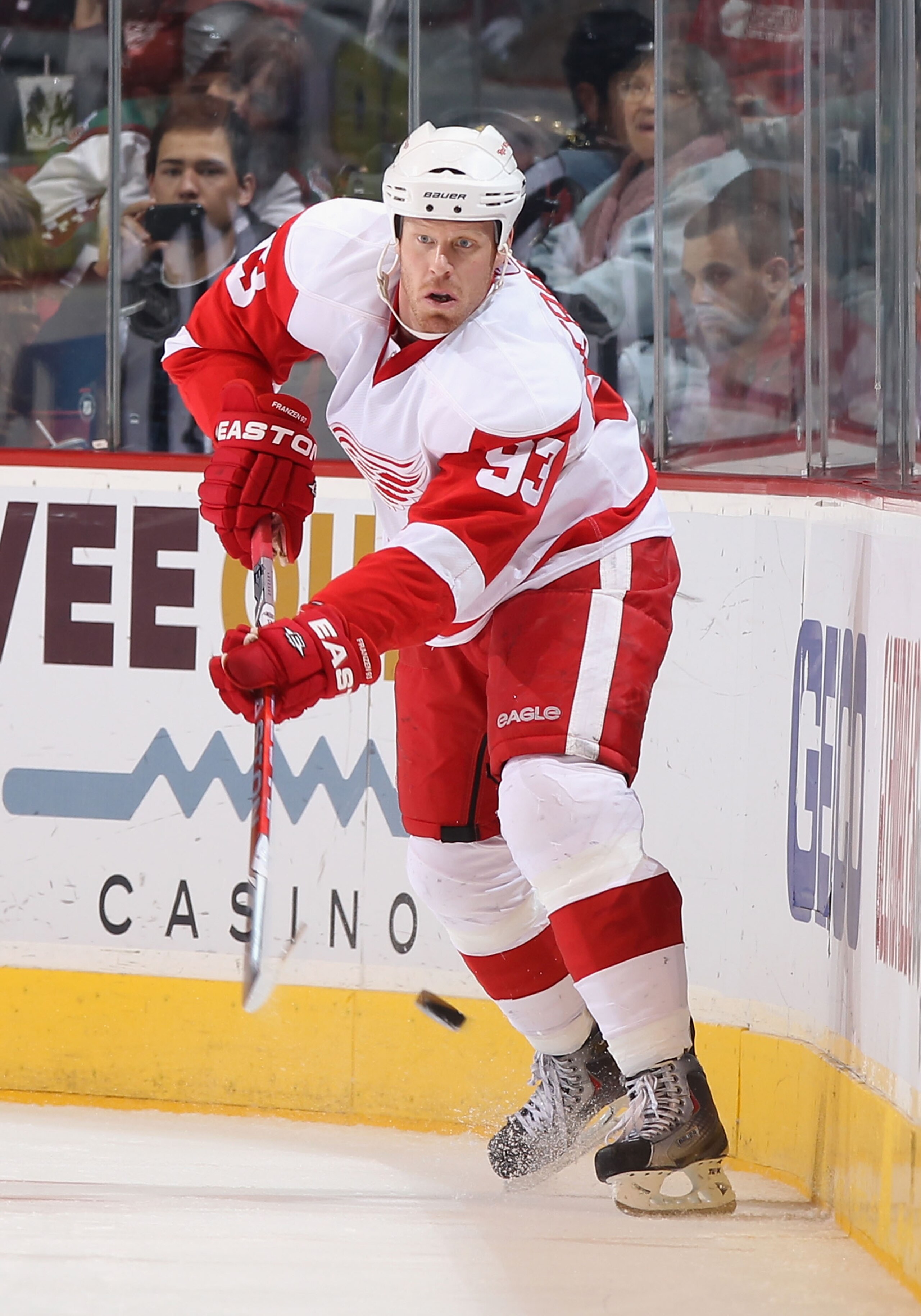 GLENDALE, AZ - MARCH 05:  Johan Franzen #93 of the Detroit Red Wings passes the puck during the NHL game against the Phoenix Coyotes at Jobing.com Arena on March 5, 2011 in Glendale, Arizona. The Coyotes defeated the Red Wings 5-4 in an overtime shoot out