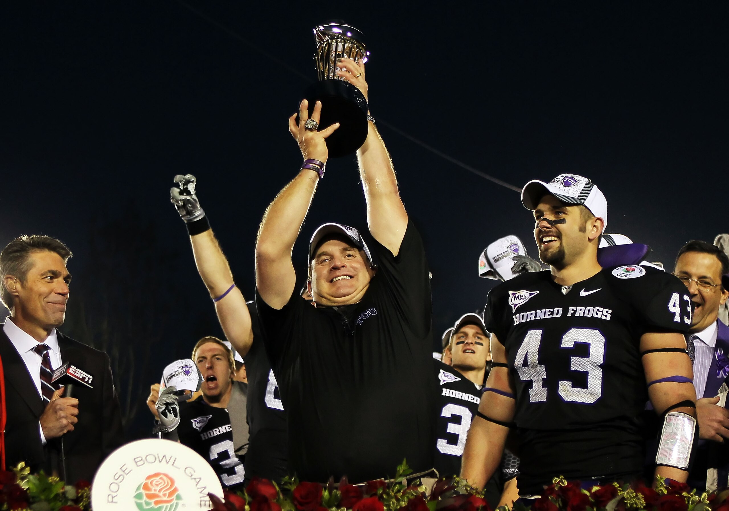 PASADENA, CA - JANUARY 01:  Head coach Gary Patterson of the TCU Horned Frogs holds the Rose Bowl Championship Trophy after defeating the Wisconsin Badgers 21-19 in the 97th Rose Bowl game on January 1, 2011 in Pasadena, California.  (Photo by Jeff Gross/