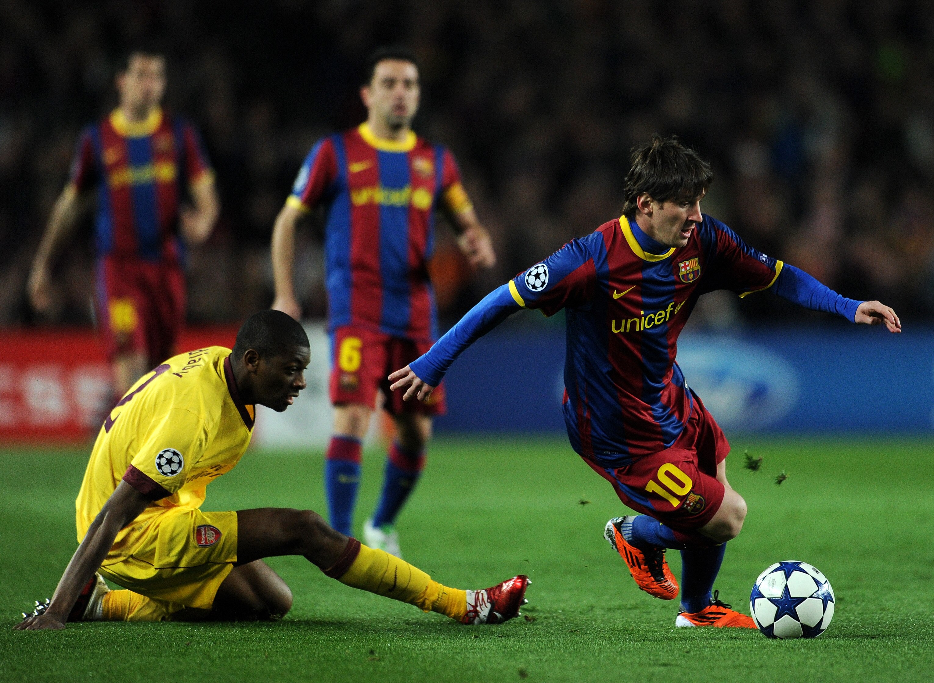 BARCELONA, SPAIN - MARCH 08:  Abou Diaby (L) of Arsenal fails to stop Lionel Messi of Barcelona during the UEFA Champions League round of 16 second leg match between Barcelona and Arsenal on March 8, 2011 in Barcelona, Spain.  (Photo by Jasper Juinen/Gett