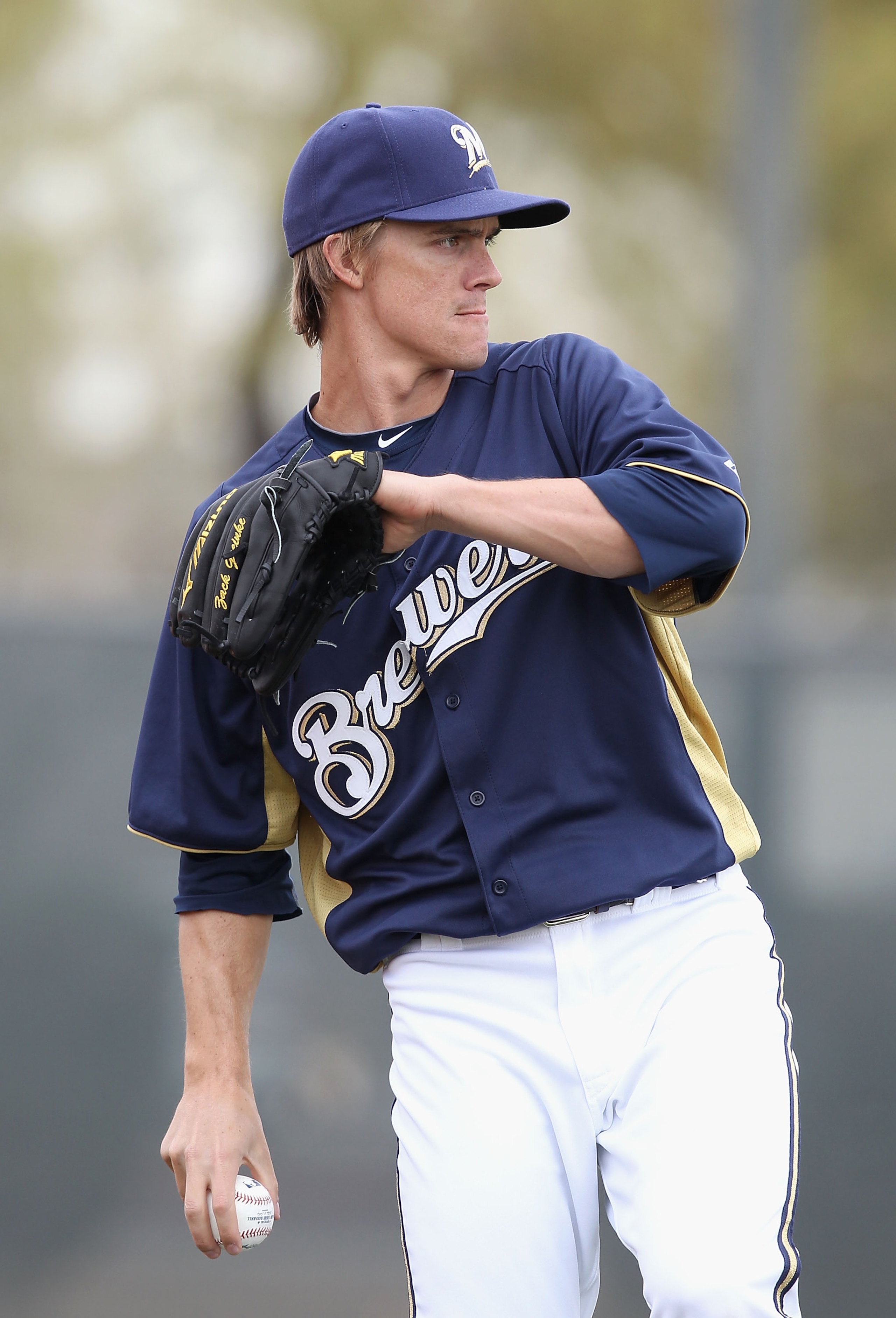 PHOENIX, AZ - FEBRUARY 18:  Pitcher Zack Greinke #13 of the Milwaukee Brewers warms up during a MLB spring training practice at Maryvale Baseball Park on February 18, 2011 in Phoenix, Arizona.  (Photo by Christian Petersen/Getty Images)