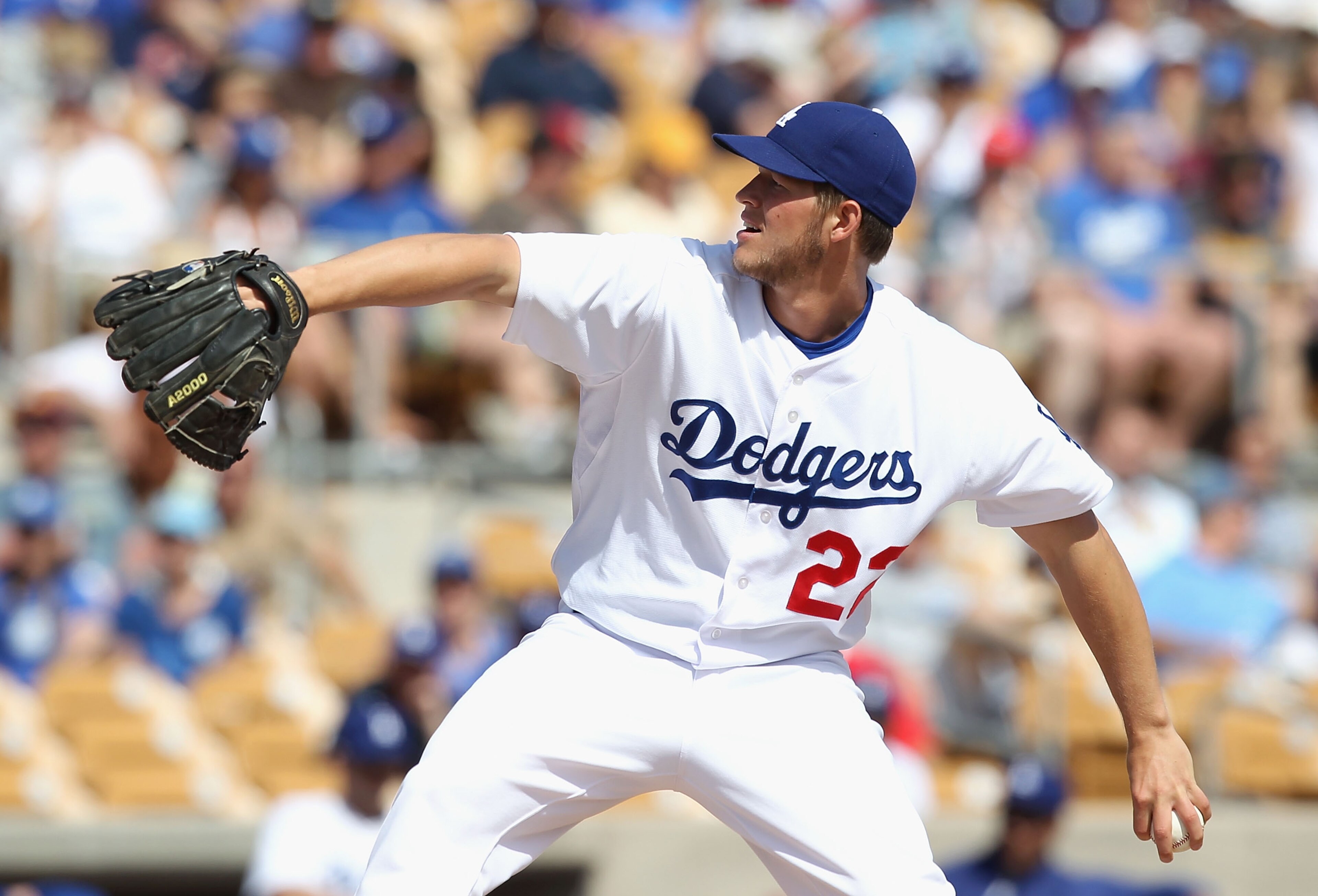 GLENDALE, AZ - MARCH 05:  Starting pitcher Clayton Kershaw #22 of the Los Angeles Dodgers pitches against the Cincinnati Reds during the spring training game at Camelback Ranch on March 5, 2011 in Glendale, Arizona.  (Photo by Christian Petersen/Getty Ima