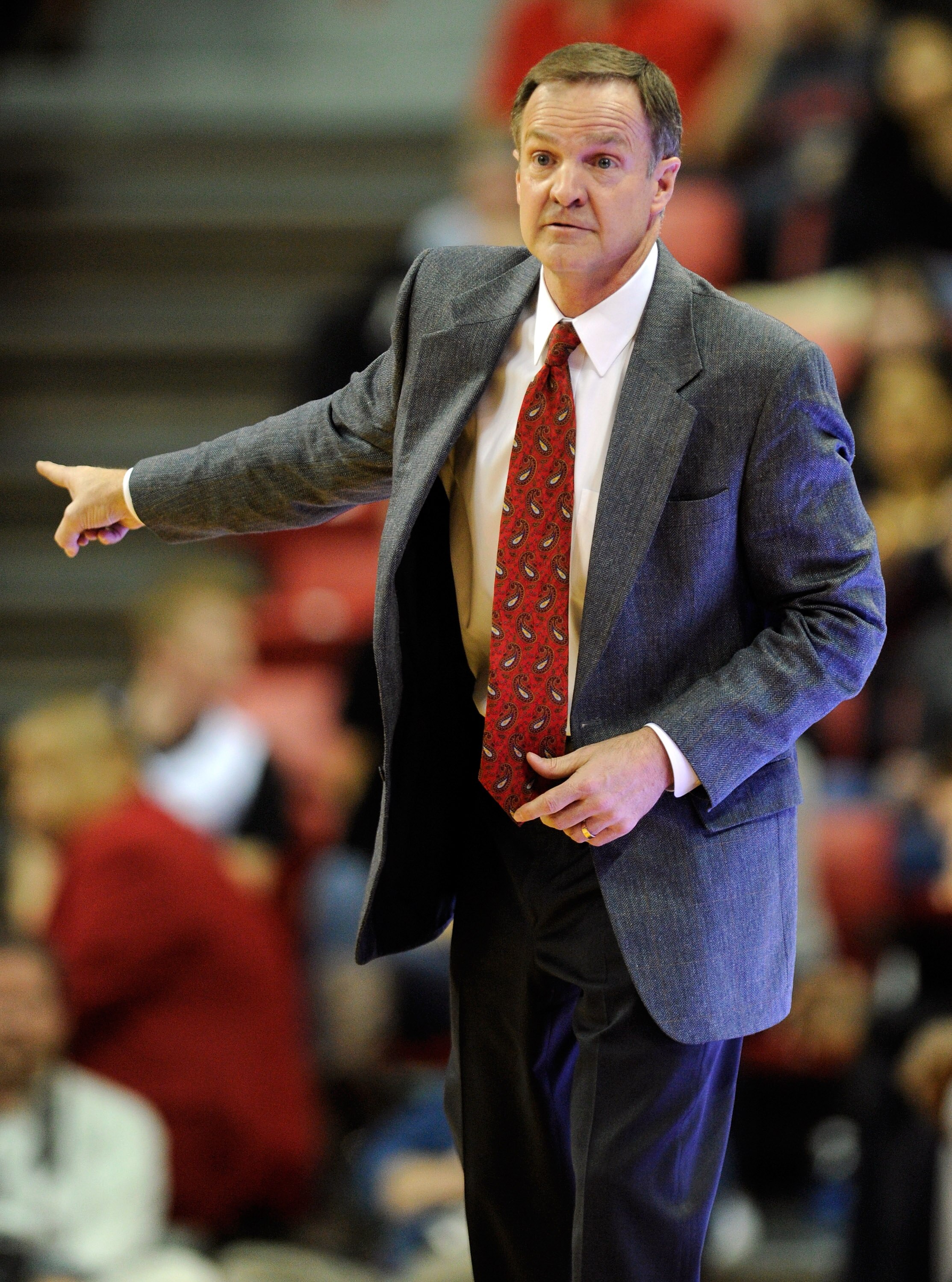 LAS VEGAS, NV - FEBRUARY 15:  Head coach Lon Kruger of the UNLV Rebels gestures during a game against the Air Force Falcons at the Thomas & Mack Center February 15, 2011 in Las Vegas, Nevada. UNLV won 49-42.  (Photo by Ethan Miller/Getty Images)