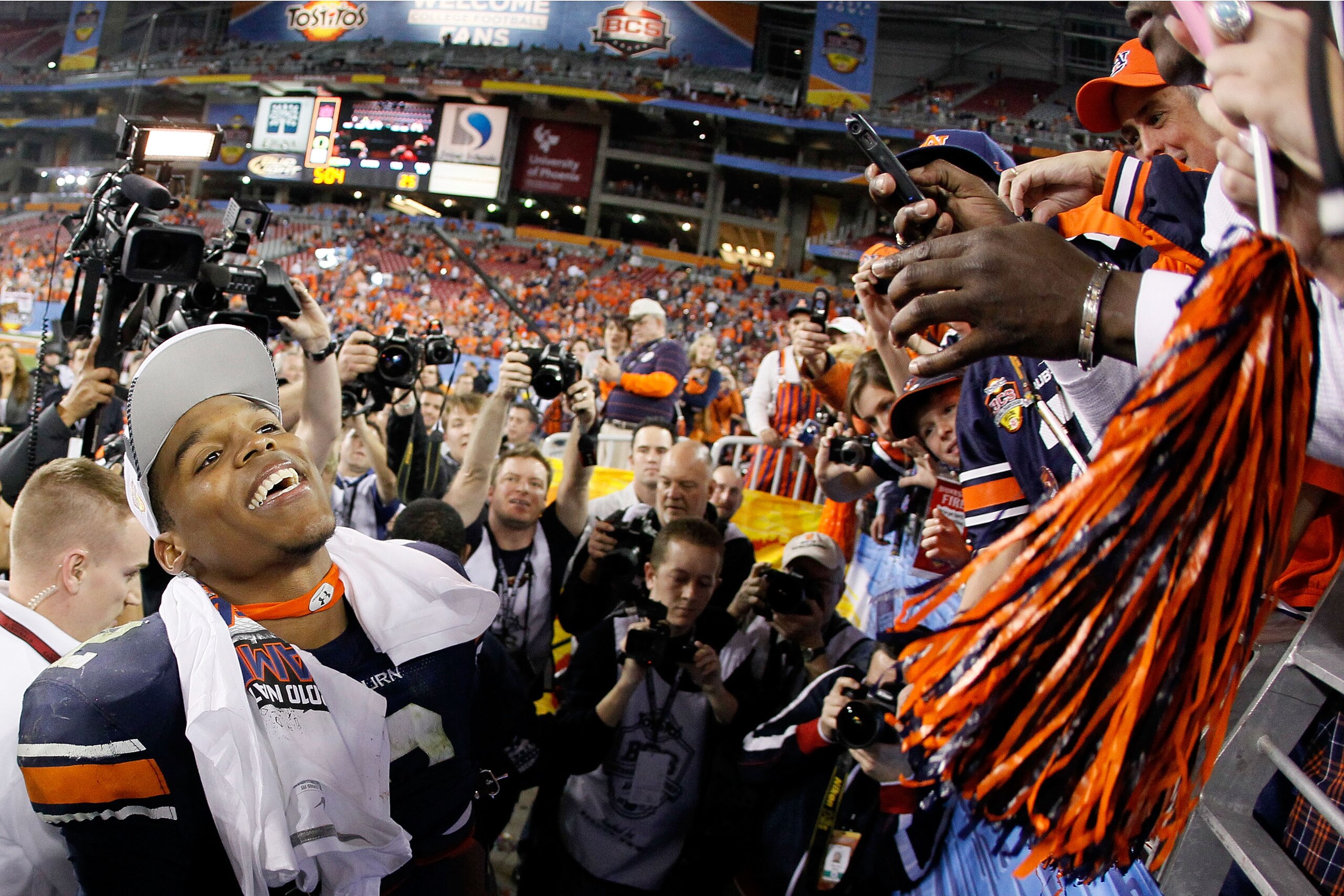 GLENDALE, AZ - JANUARY 10:  Quarterback Cameron Newton #2 of the Auburn Tigers celebrates their 22-19 victory after defeating the Oregon Ducks in the Tostitos BCS National Championship Game at University of Phoenix Stadium on January 10, 2011 in Glendale,