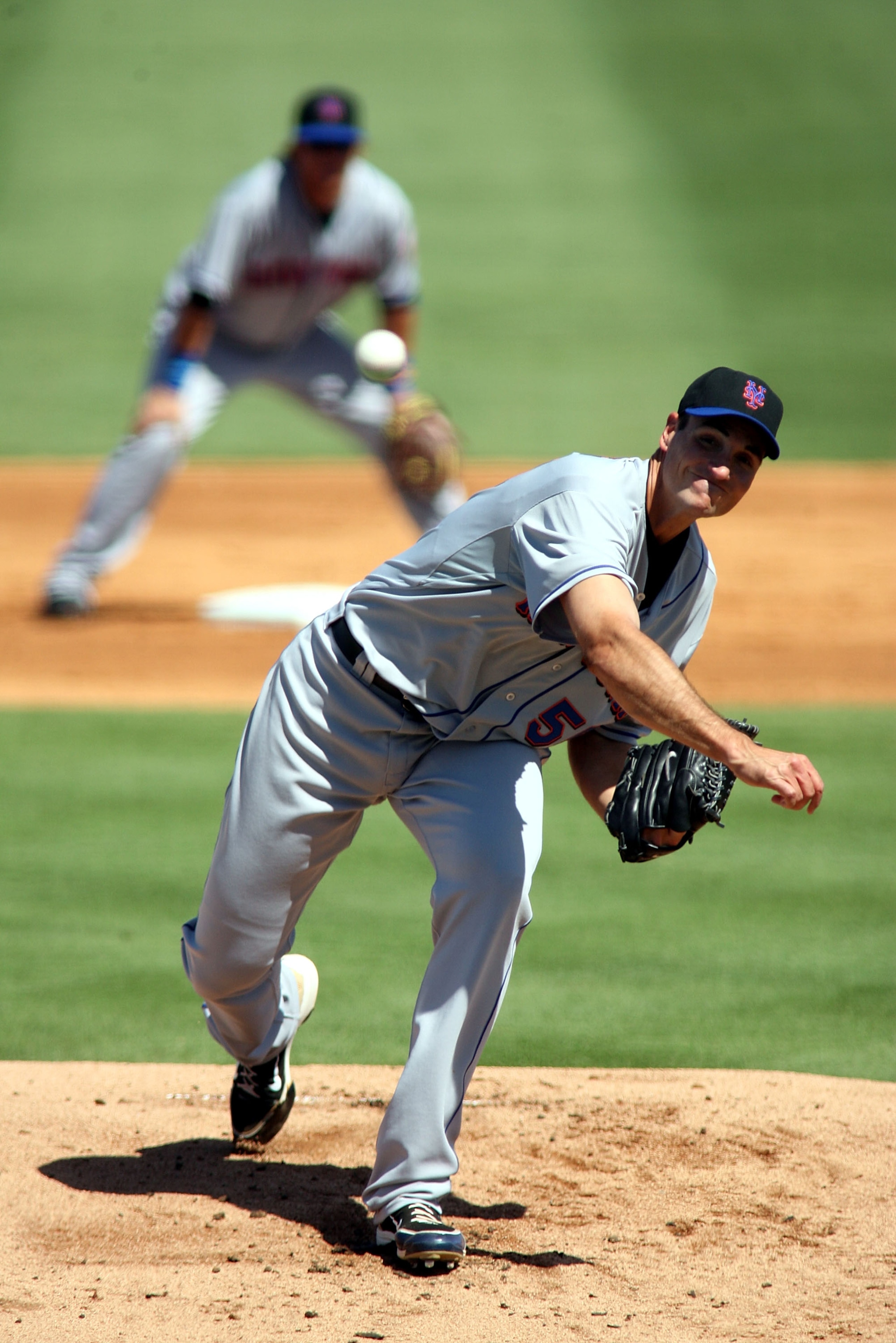 JUPITER, FL - MARCH 04:  Pitcher Chris Young #55 of the New York Mets throws against the Florida Marlins at Roger Dean Stadium on March 4, 2011 in Jupiter, Florida.  (Photo by Marc Serota/Getty Images)
